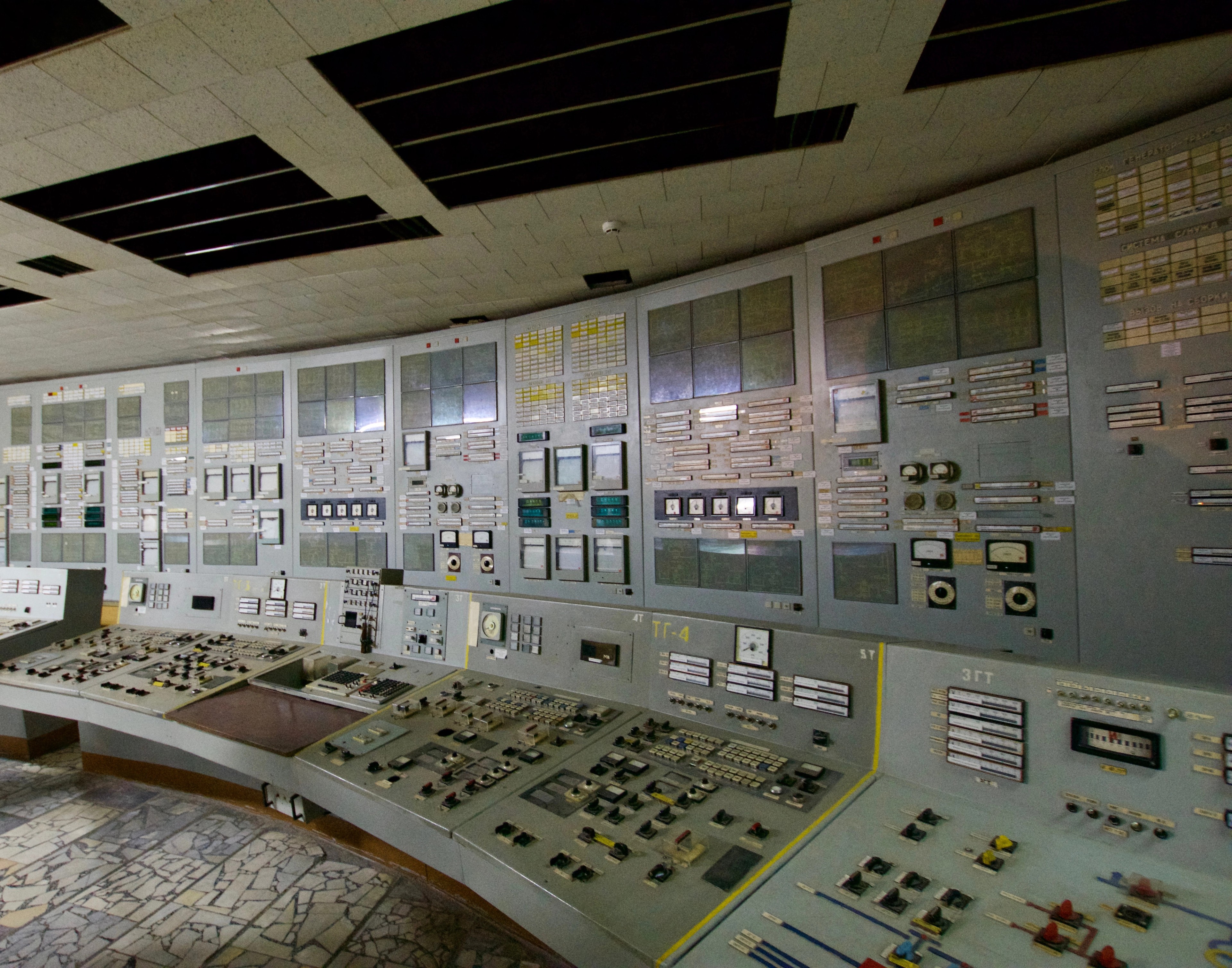 A wall of control panels fills a large room.