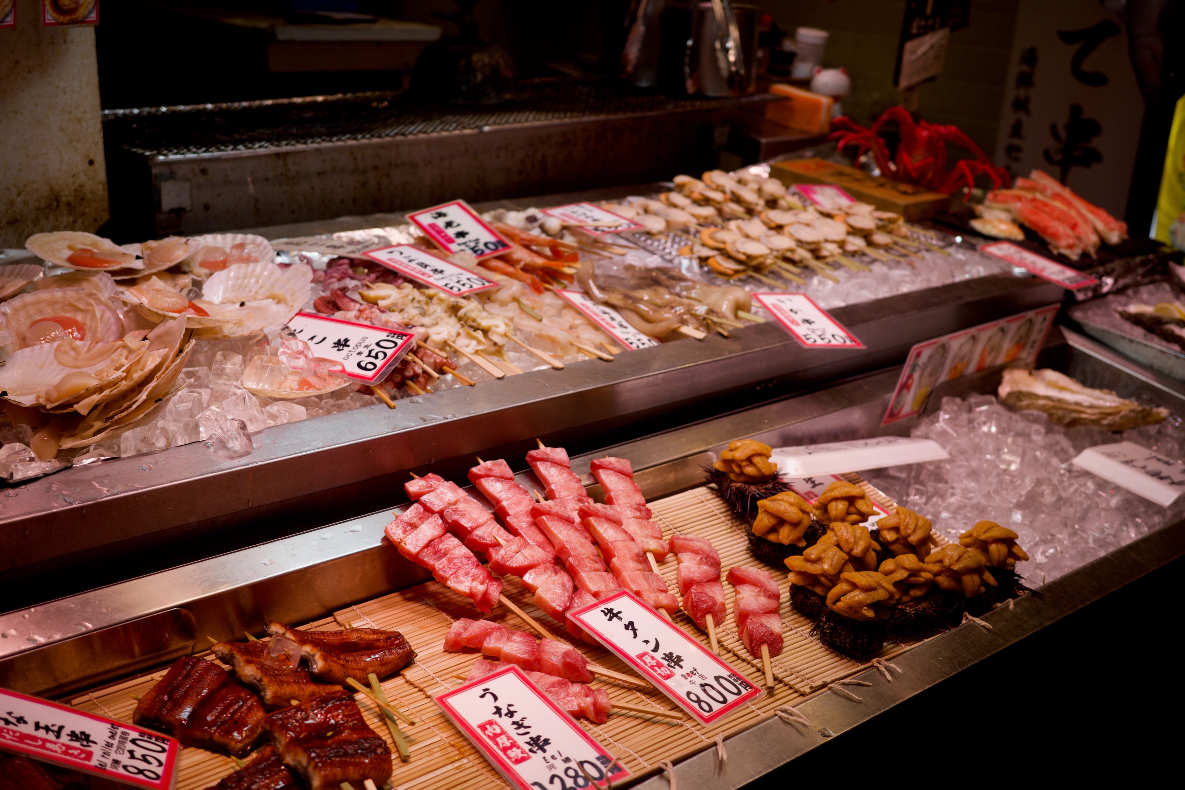 A display counter holds cuts of meat and prepared dishes.