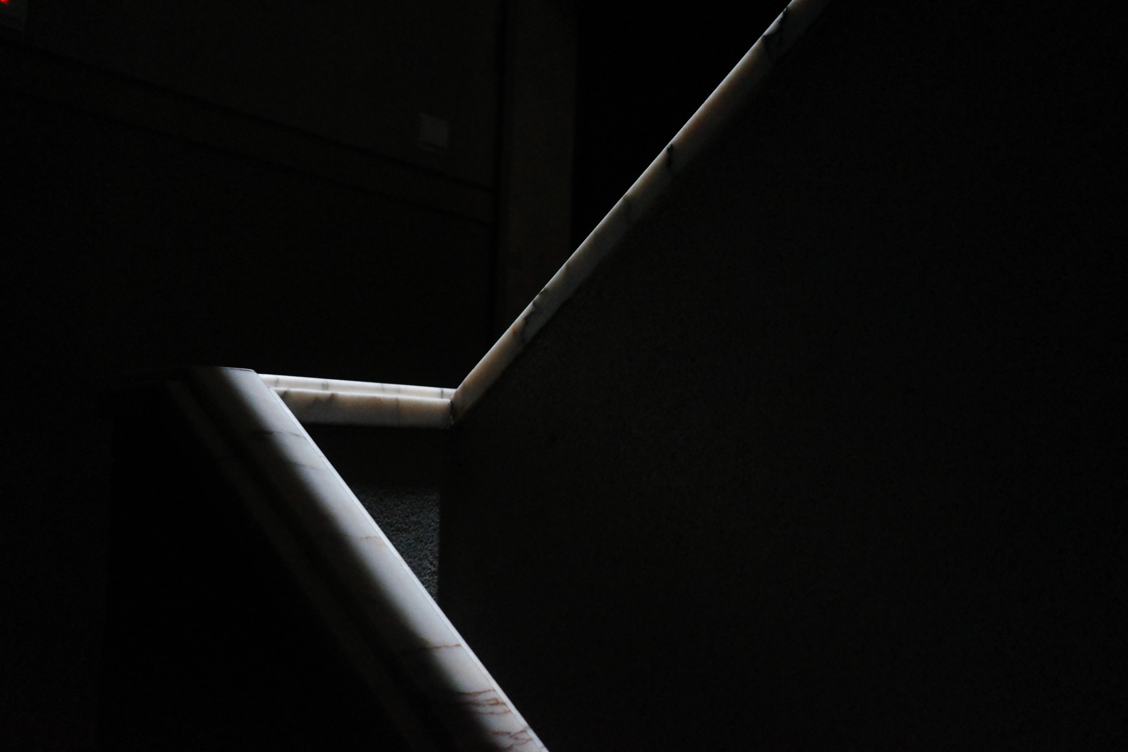A bright white zigzag structure crosses a nearly black interior.