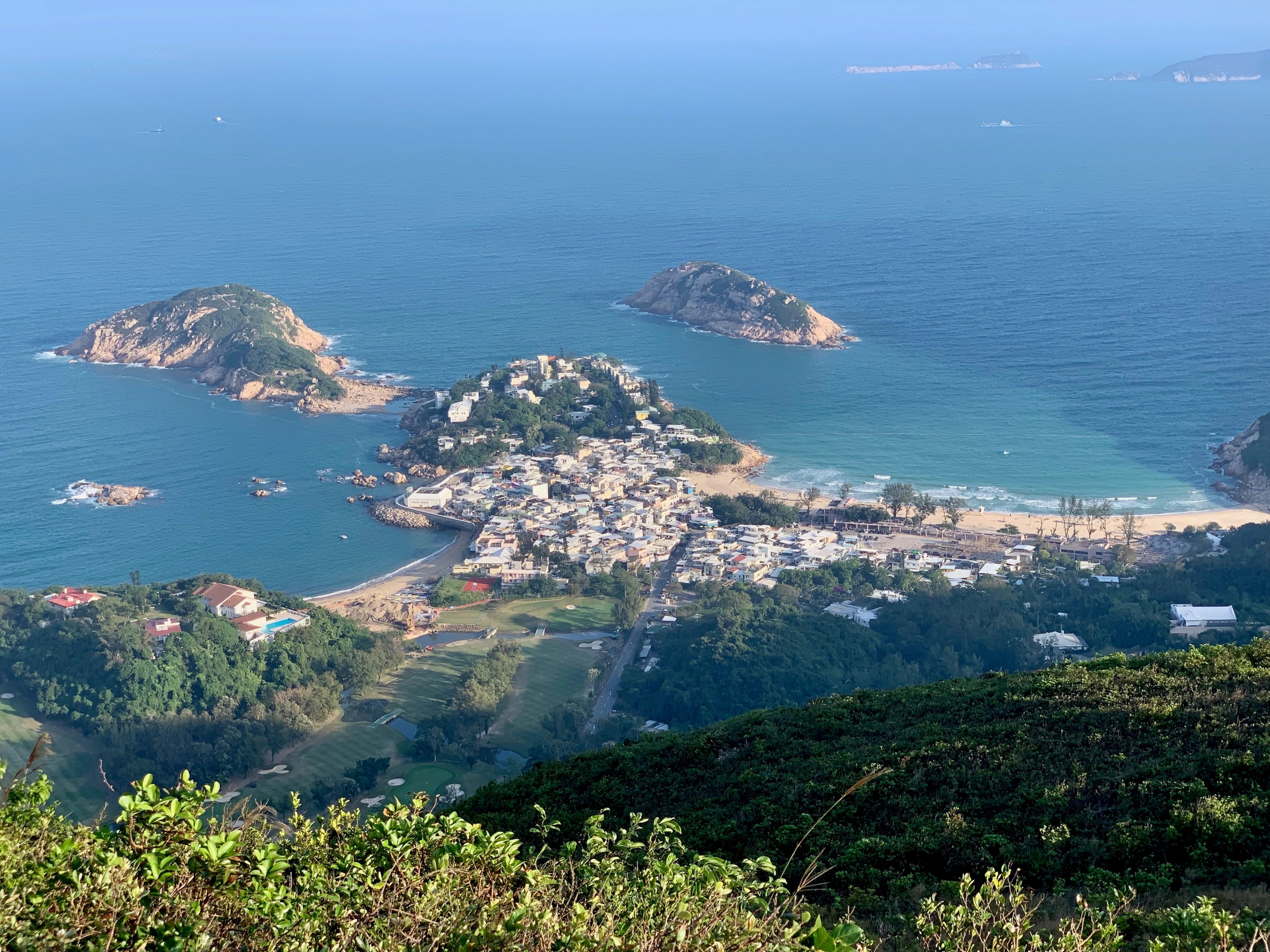 Small islands scattered across the sea, seen from a high viewpoint.