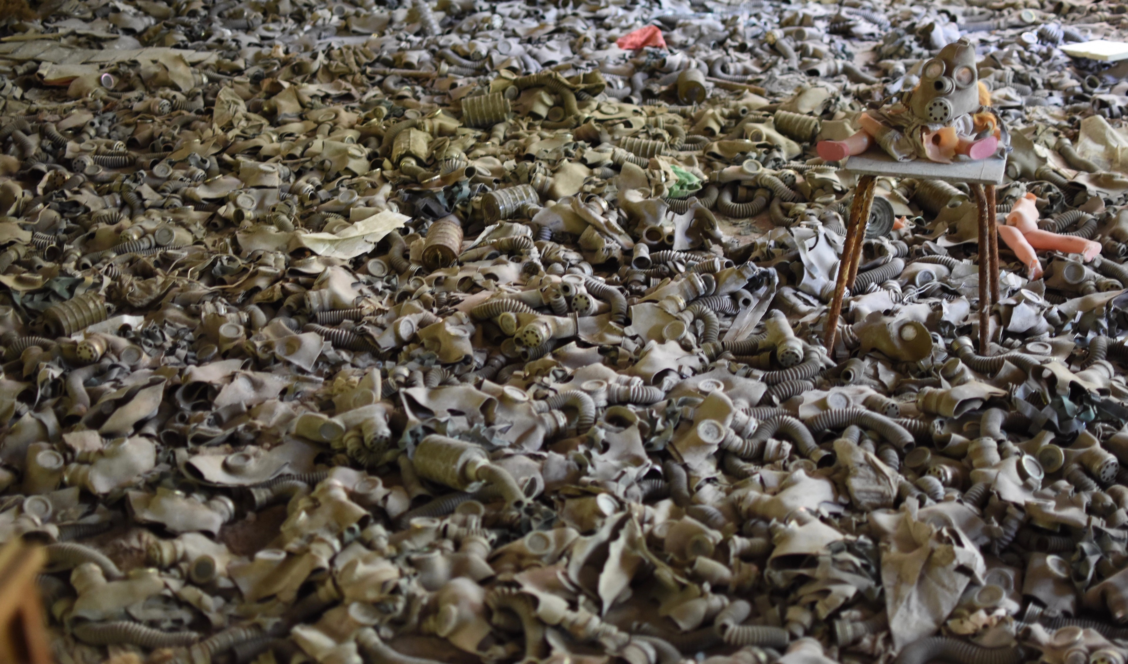 Broken brick and rubble cover the floor.