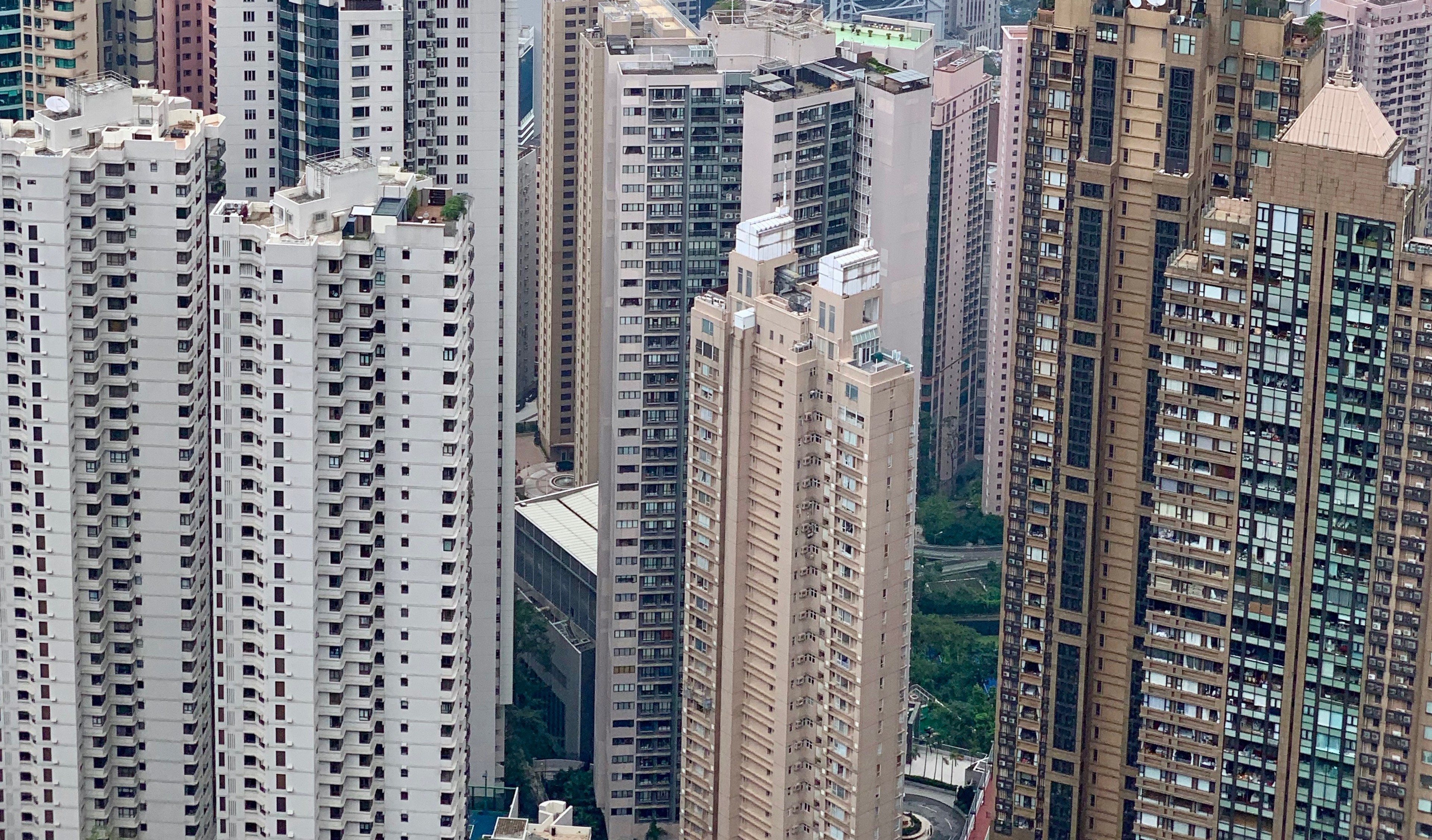 Dense Hong Kong apartment towers seen from above.