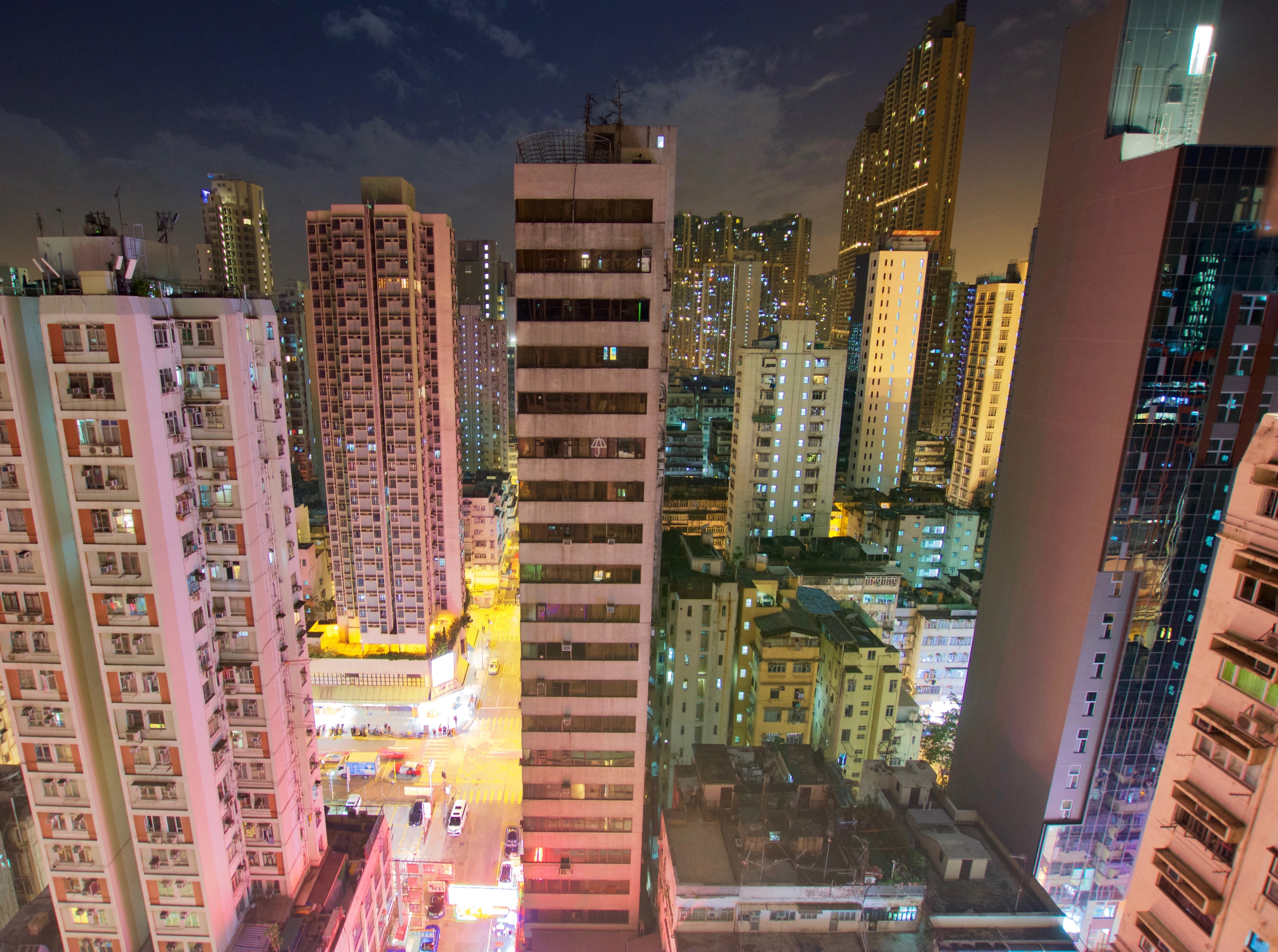 City buildings appear distorted in the reflection of a glass window.