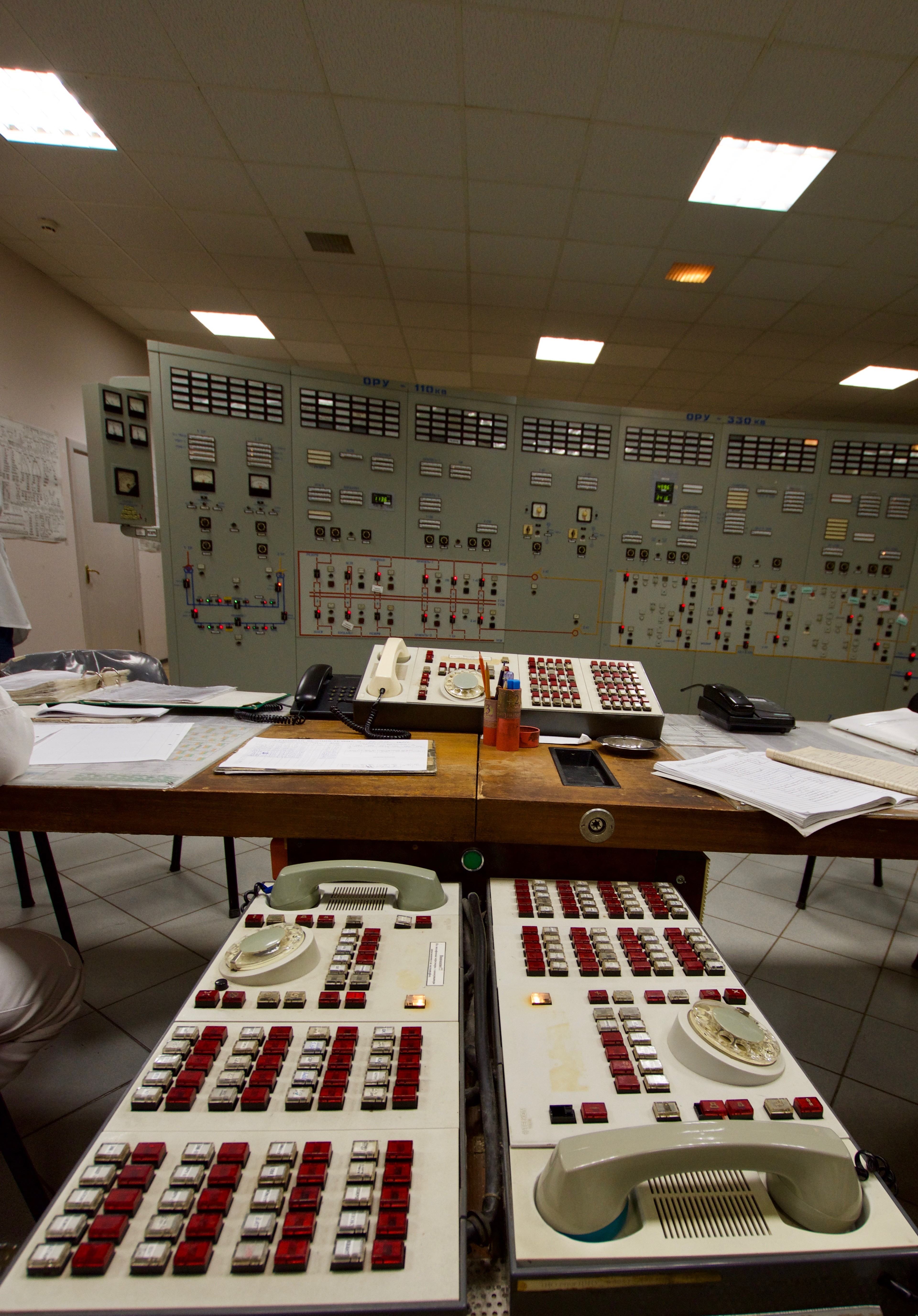 A close view of switches and instruments on a control panel.