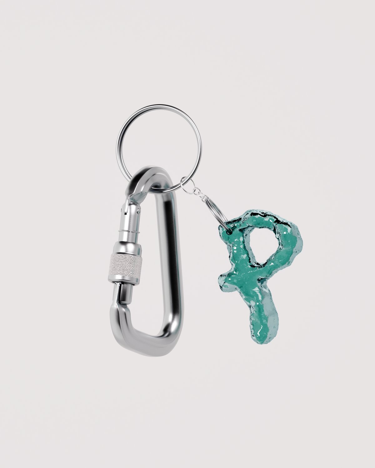 A keychain features a silver carabiner and a teal, textured "P" pendant.