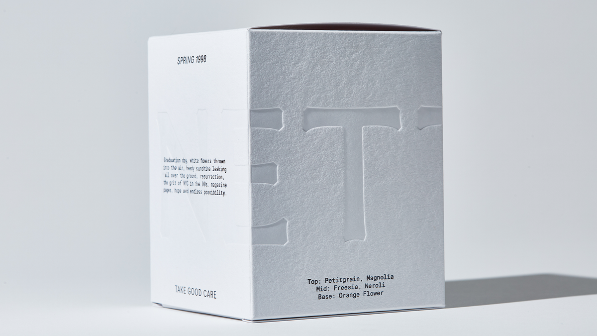 White NETTE packaging box with embossed logo and fragrance notes