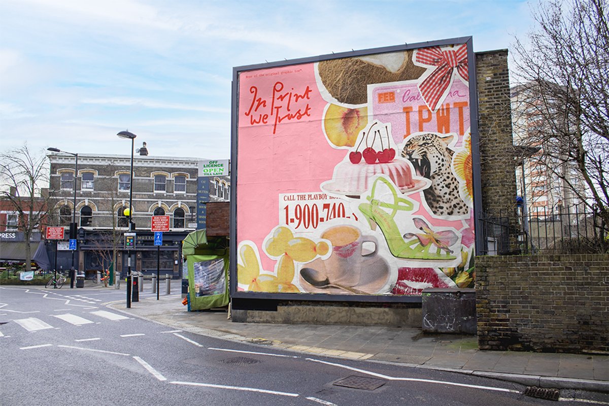 A large pink billboard displays a collage of images related to print and trust, including a cake, cherries, a leopard, a high heel shoe, and yellow corn chips. The billboard also features the text...