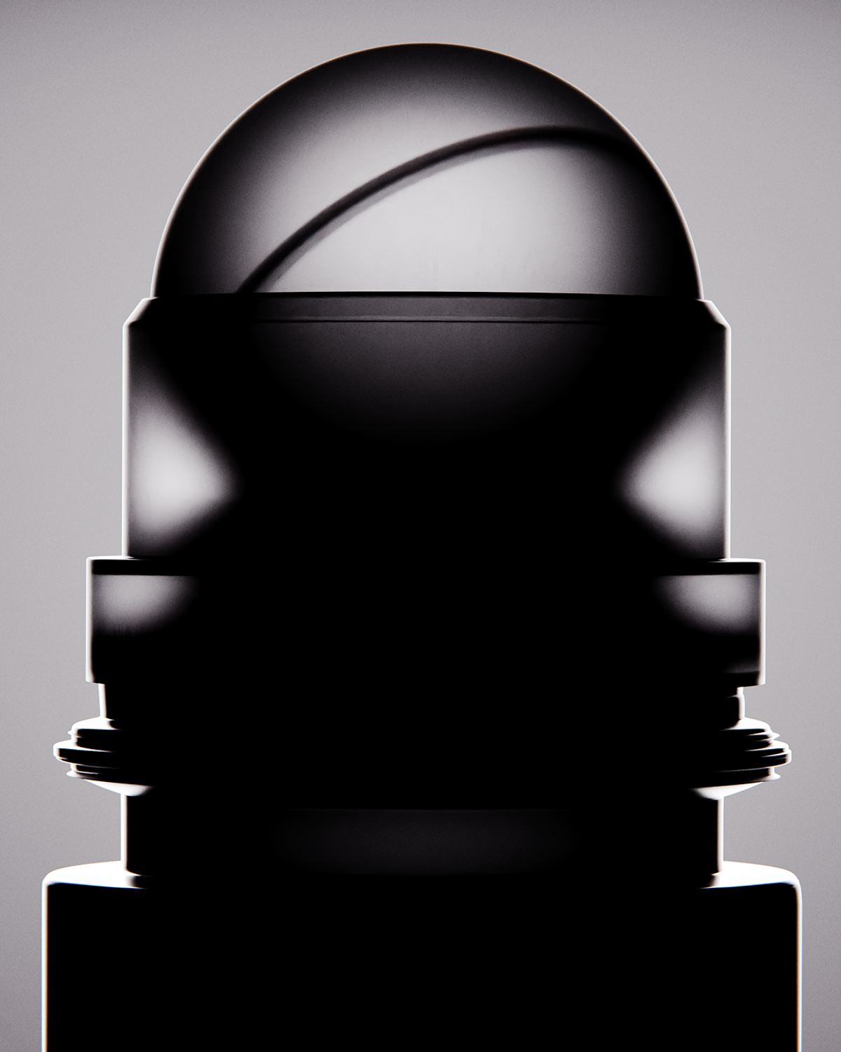 A dark, cylindrical object with a domed top and reflective surface is shown against a light gray background. The object has a textured base and a smooth, reflective dome.