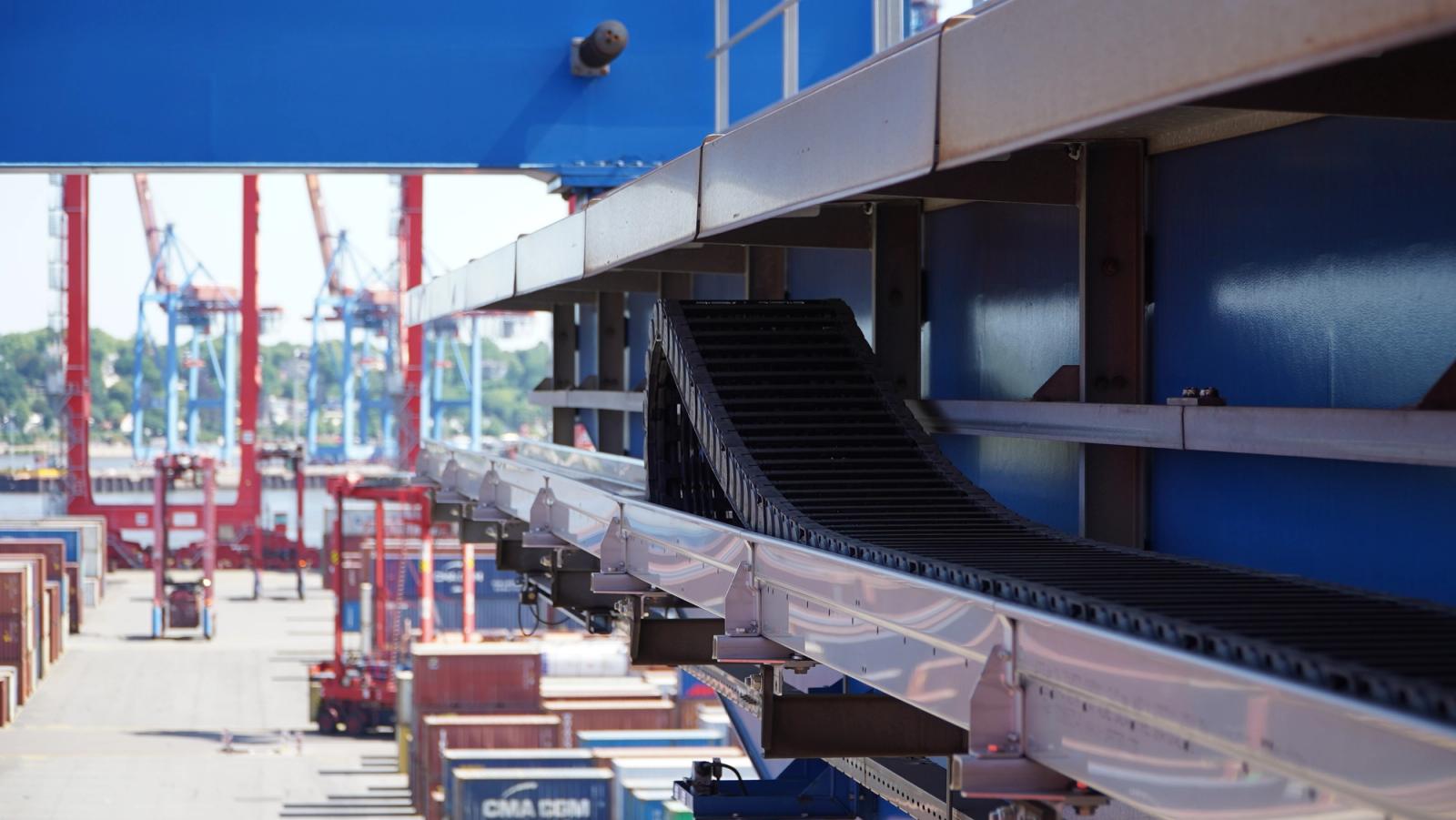 igus energy chain on container crane boom in port