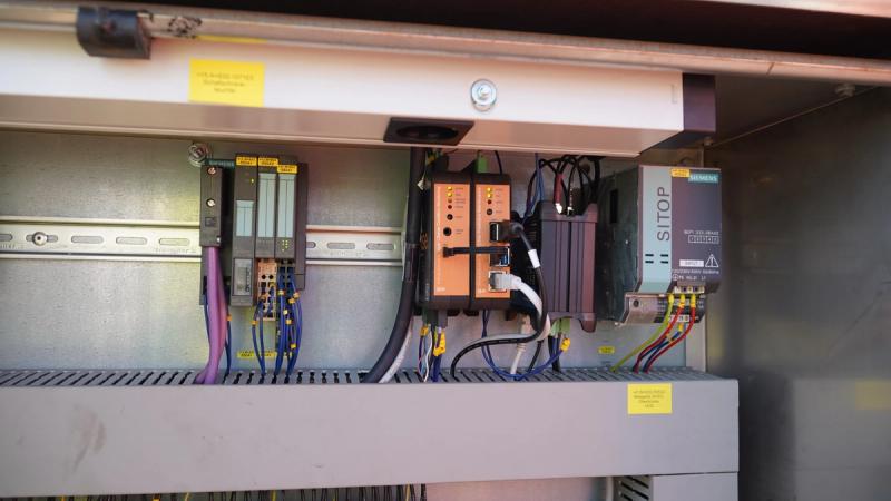 Siemens S7 PLC and i.Sense controller in control cabinet on container crane trolley