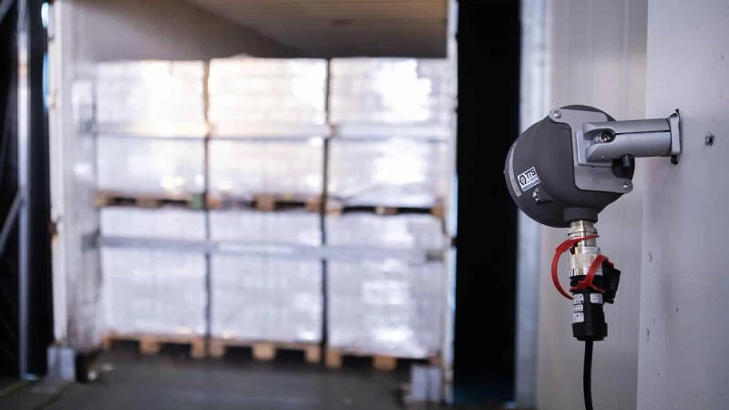 Cable pull sensor at loading dock for automated loading documentation with pallets in background