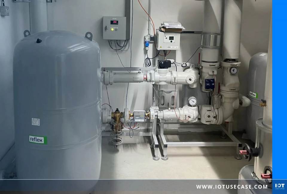 Heating plant room with a heat meter on the pipework, pressure gauges and a grey expansion vessel