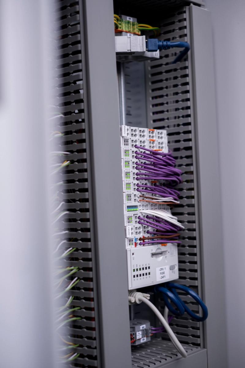 Control cabinet with PLC modules and Profibus wiring for data center automation