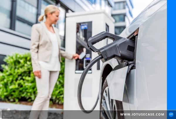 Person at an EV charging station from Compleo with cellular connectivity via an IoT module from Telit