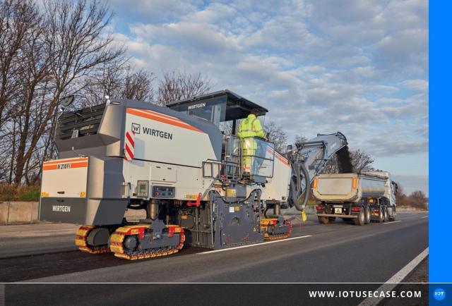 Large cold milling machine from Wirtgen milling at a road construction site, its output captured by the Performance Tracker from Digital Enabler