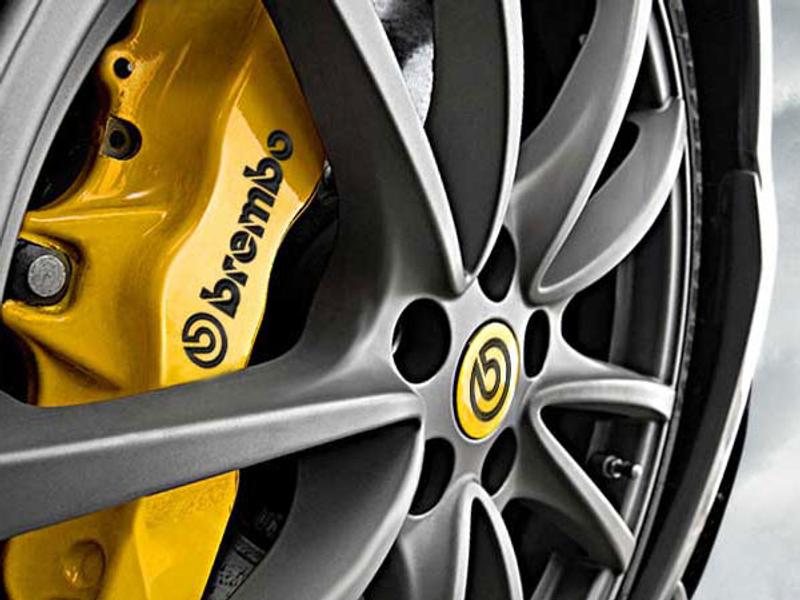 Brembo yellow high-performance brake caliper in wheel rim - close-up braking system