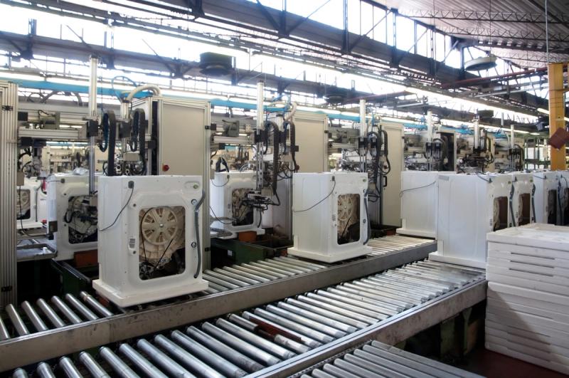 Electrolux production line with conveyor belt and manufacturing machines in factory hall