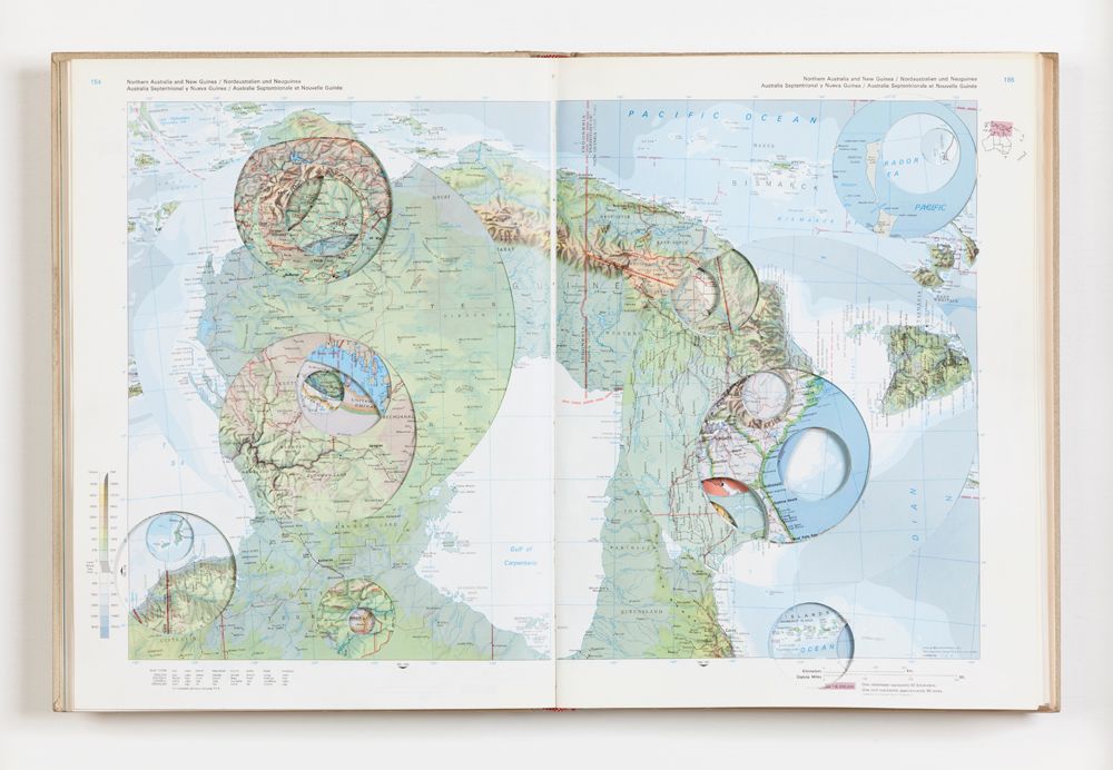 “Atlas,” | 2012 | Modified book (El Atlas de Nuestro Tiempo, 1964) | 40 x 28 cm 