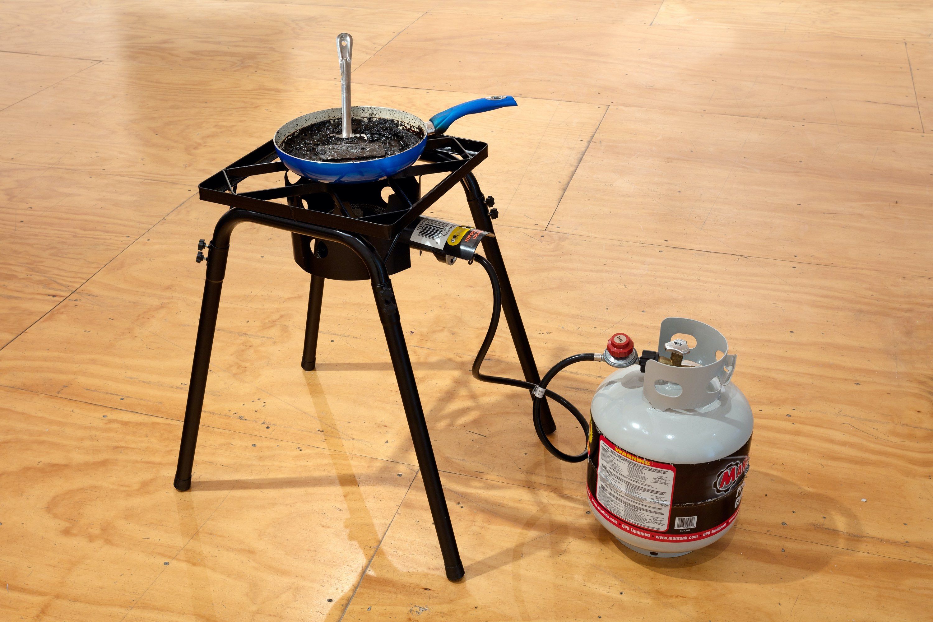 Untitled (Portal) | 2018 | Outdoor burner, propane tank, skillet, Coca-Cola, smartphone, spatula (47 Canal, NY)