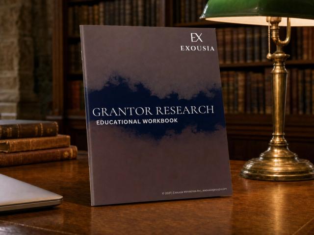 The Grantor Research workbook standing on a library reading table beneath a green-shaded brass lamp, shelves of old books behind.