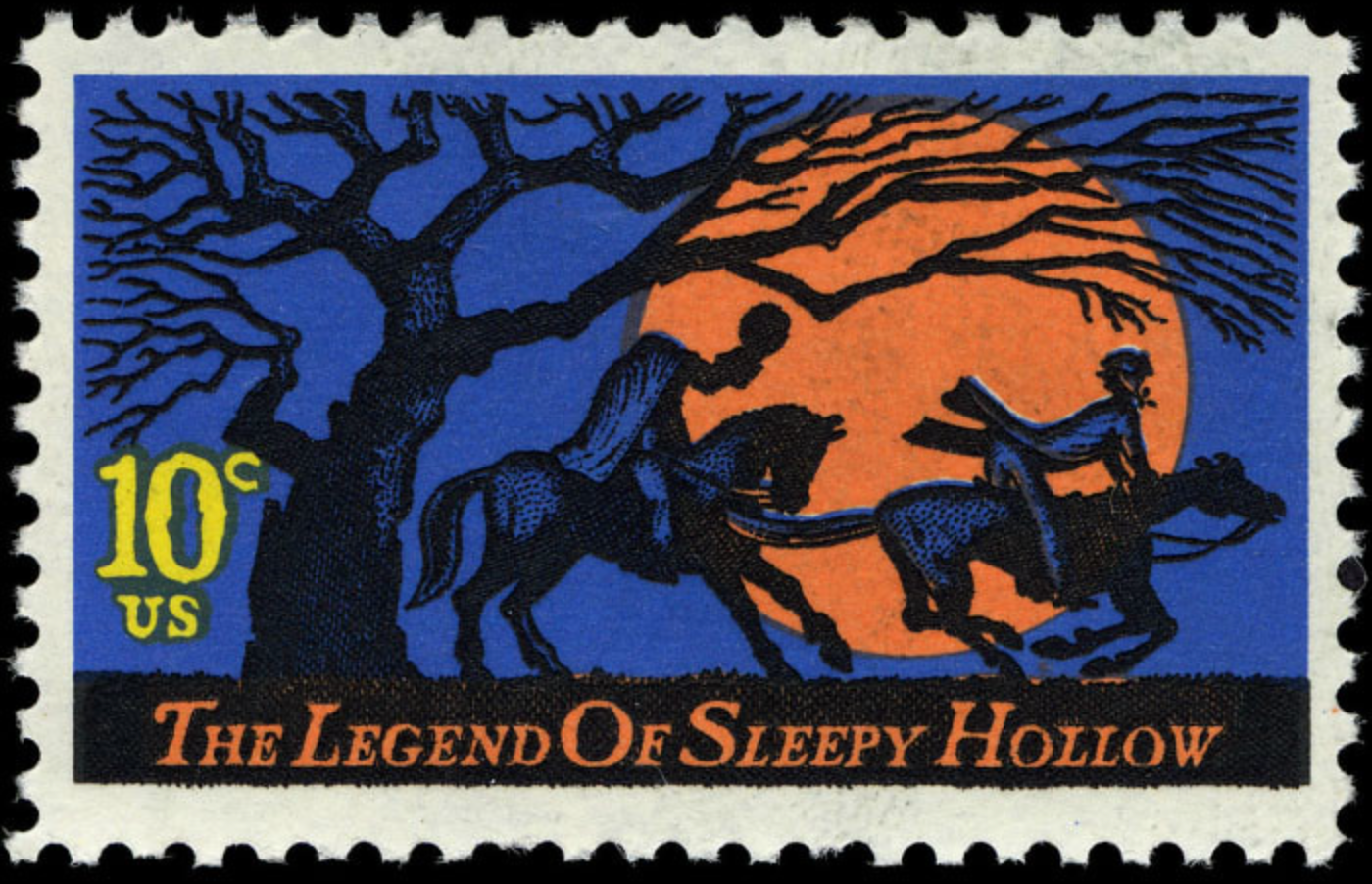 U.S. postage stamp depicting the Headless Horseman pursuing Ichabod Crane beneath a bare tree and an orange moon.