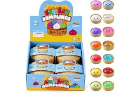 A display box containing colorful dumpling-shaped squeeze toys in multiple designs
