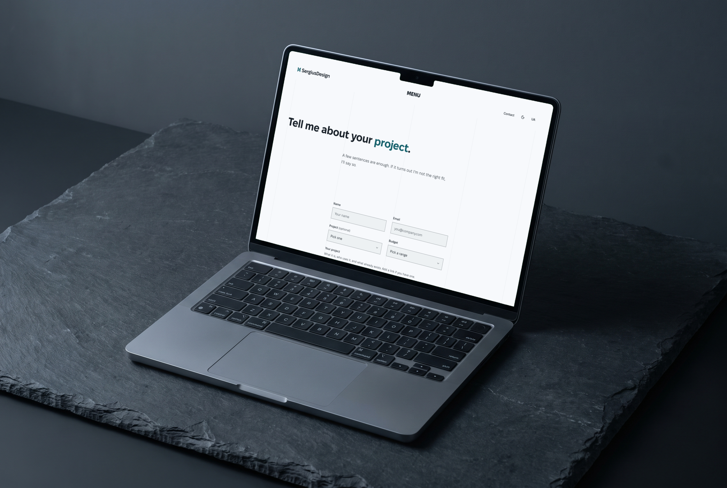 Laptop on dark slate with the sergiusdesign.com contact page: the heading “Tell me about your project” and a short form, light theme
