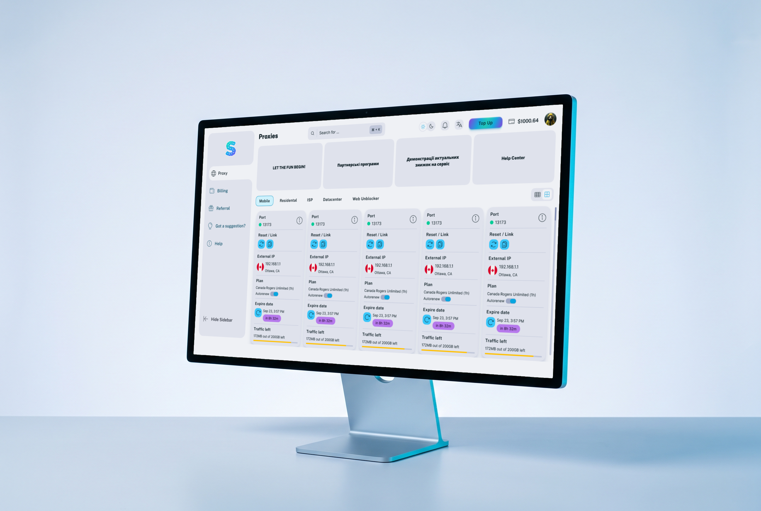 Monitor on a pale desk with the LTE Socks portal in the light theme: the Proxies section, cards of mobile proxies with port, address, plan and traffic left