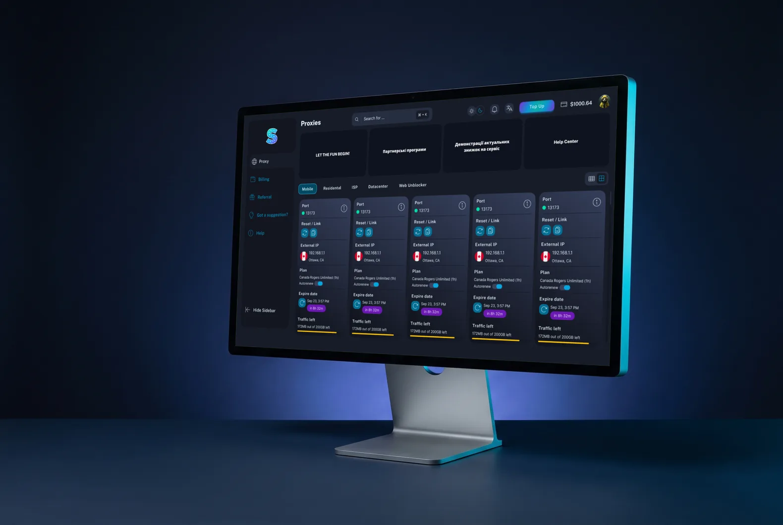 Monitor on a dark desk with the LTE Socks portal in the dark theme: the Proxies section, cards of mobile proxies with port, address, plan and traffic left