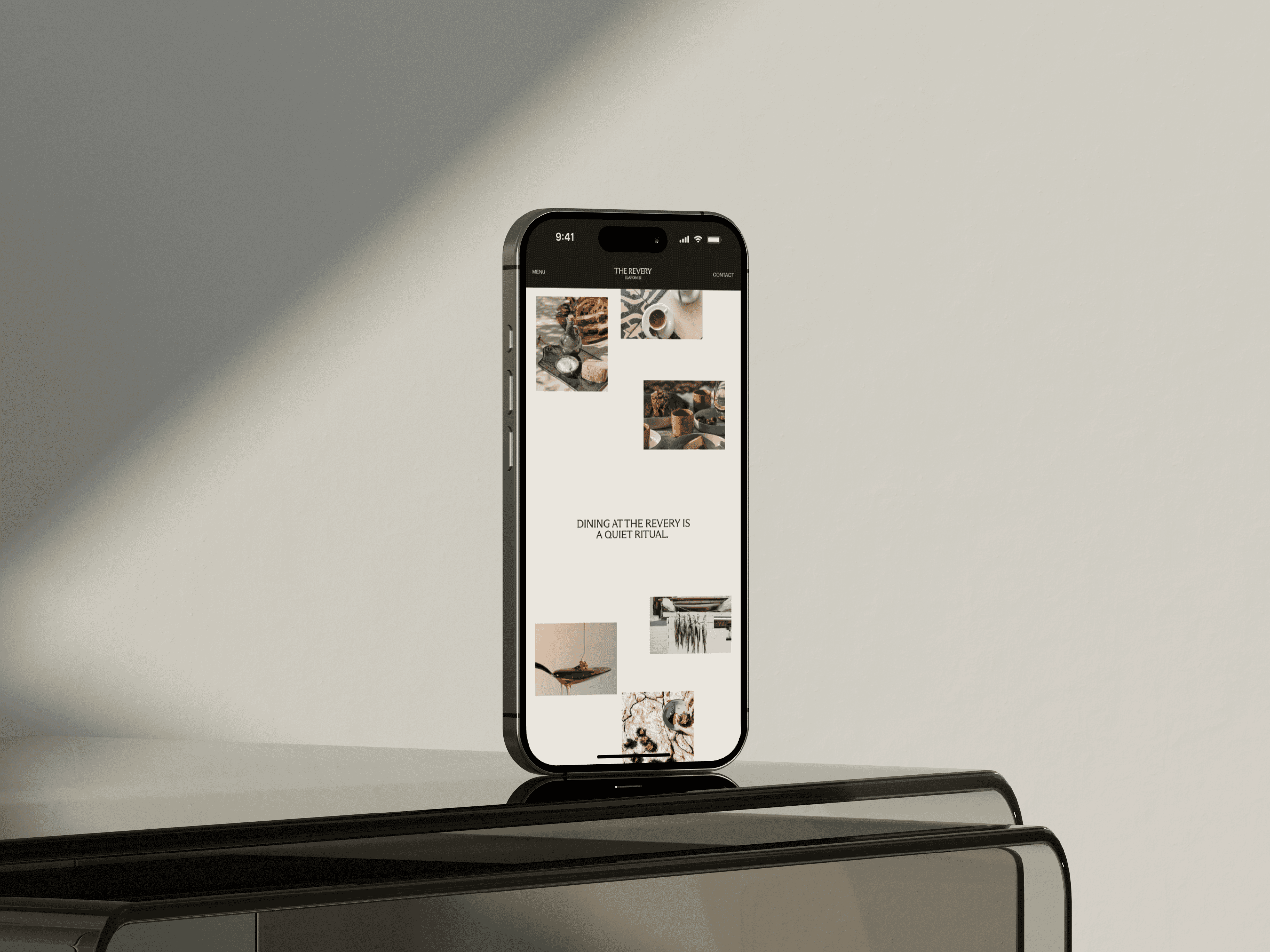 Site do The Revery num iPhone, fotos de comida em fundo creme: 'Dining at The Revery is a quiet ritual'