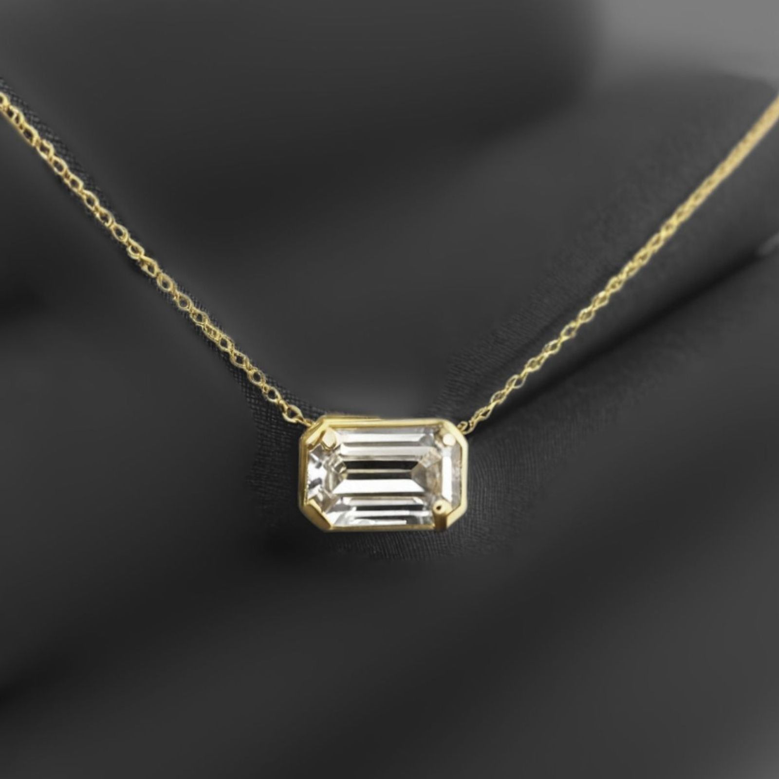 1.12Ct Emerald Diamond Pendant Necklace · 1.12 ct, Emerald Cut, F colour, SI1 clarity, EGL certified, Yellow Gold · alternate angle, photographed at the Bedfordview viewing room