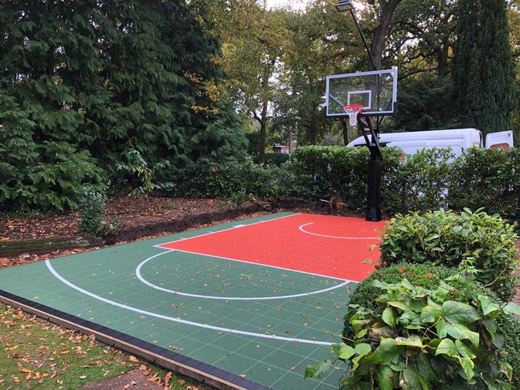 Forest Green and Cherry Red, Tucked Into the Hedge Line
