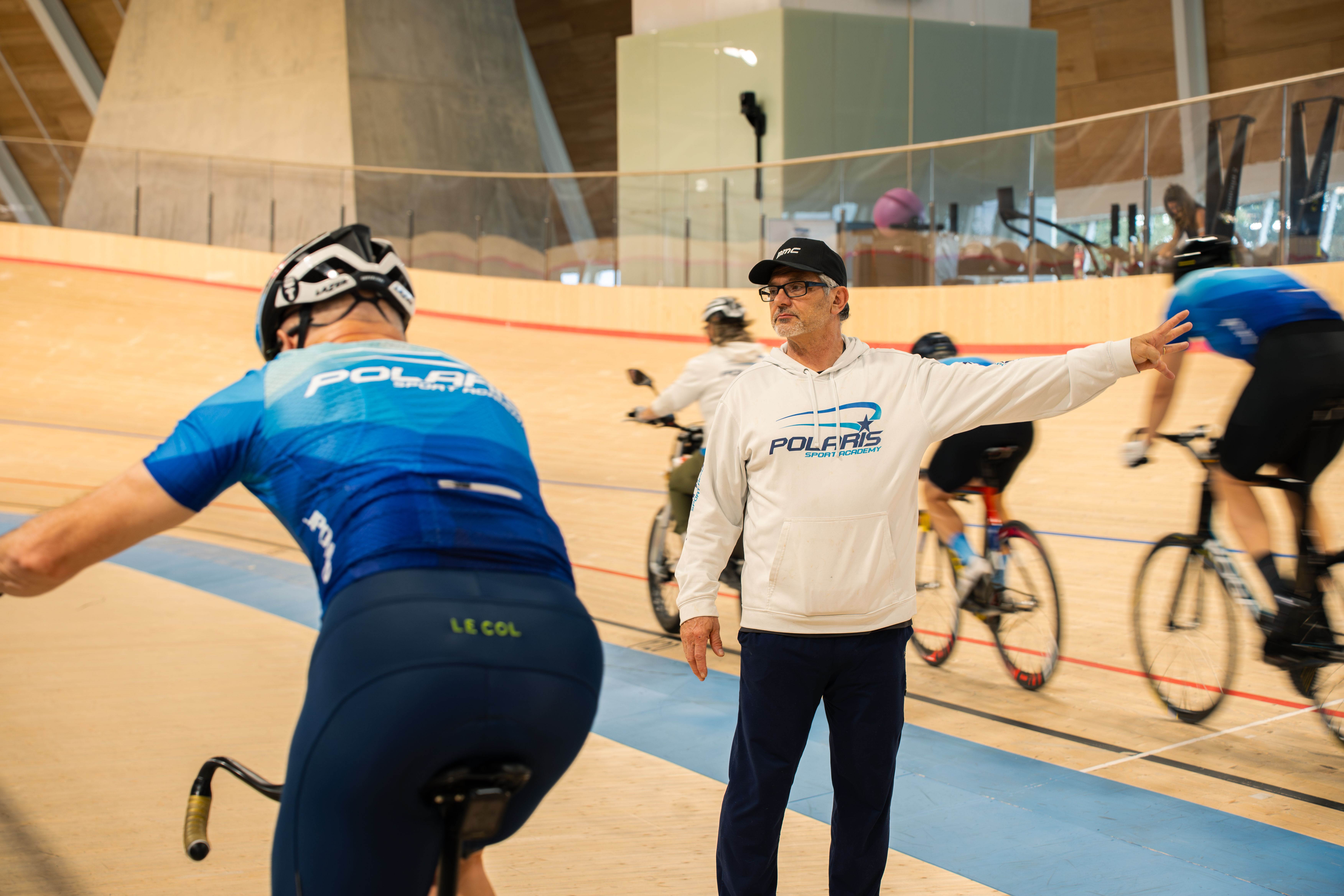 Head coach Alex Ongaro directing riders during a session