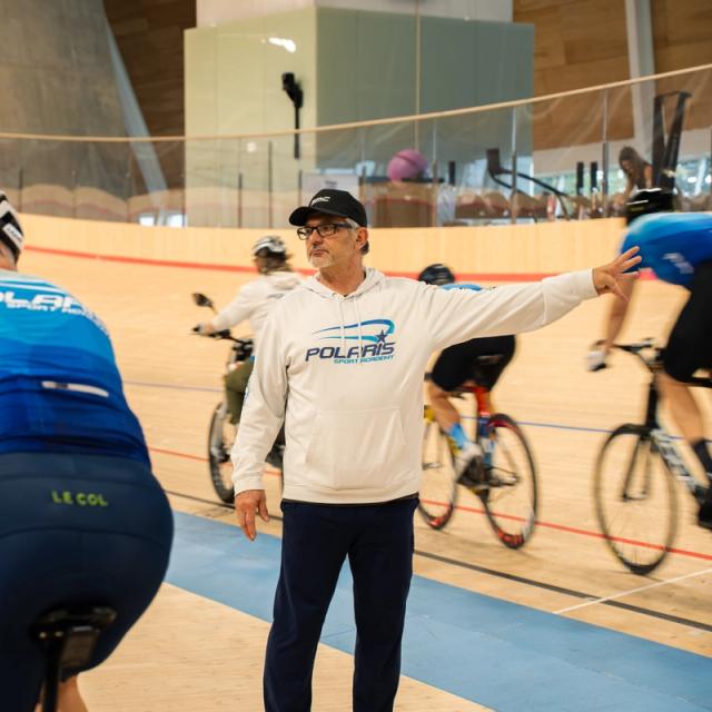Head coach Alex Ongaro directing riders during a session