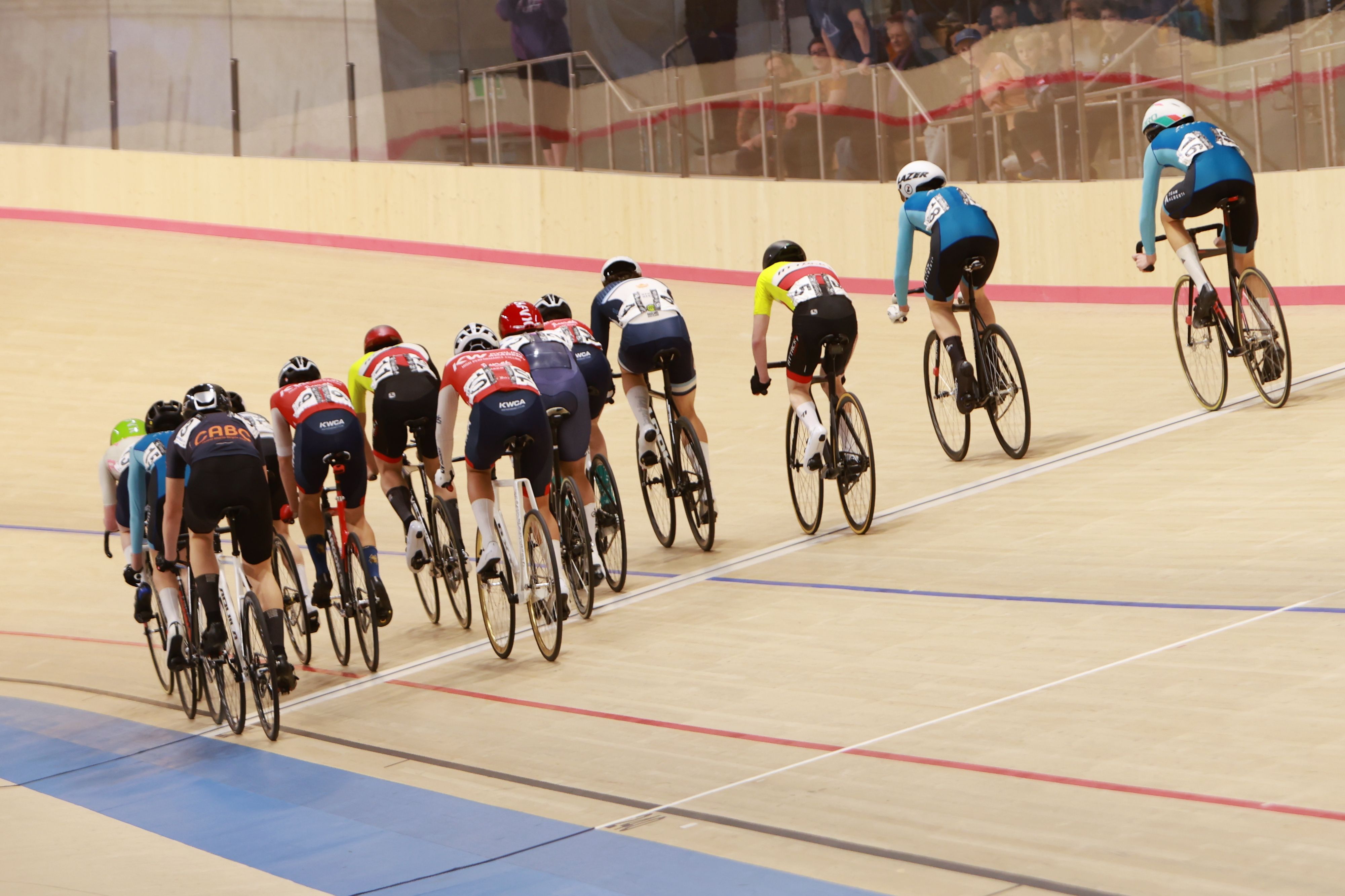 A line of riders strung out along the track