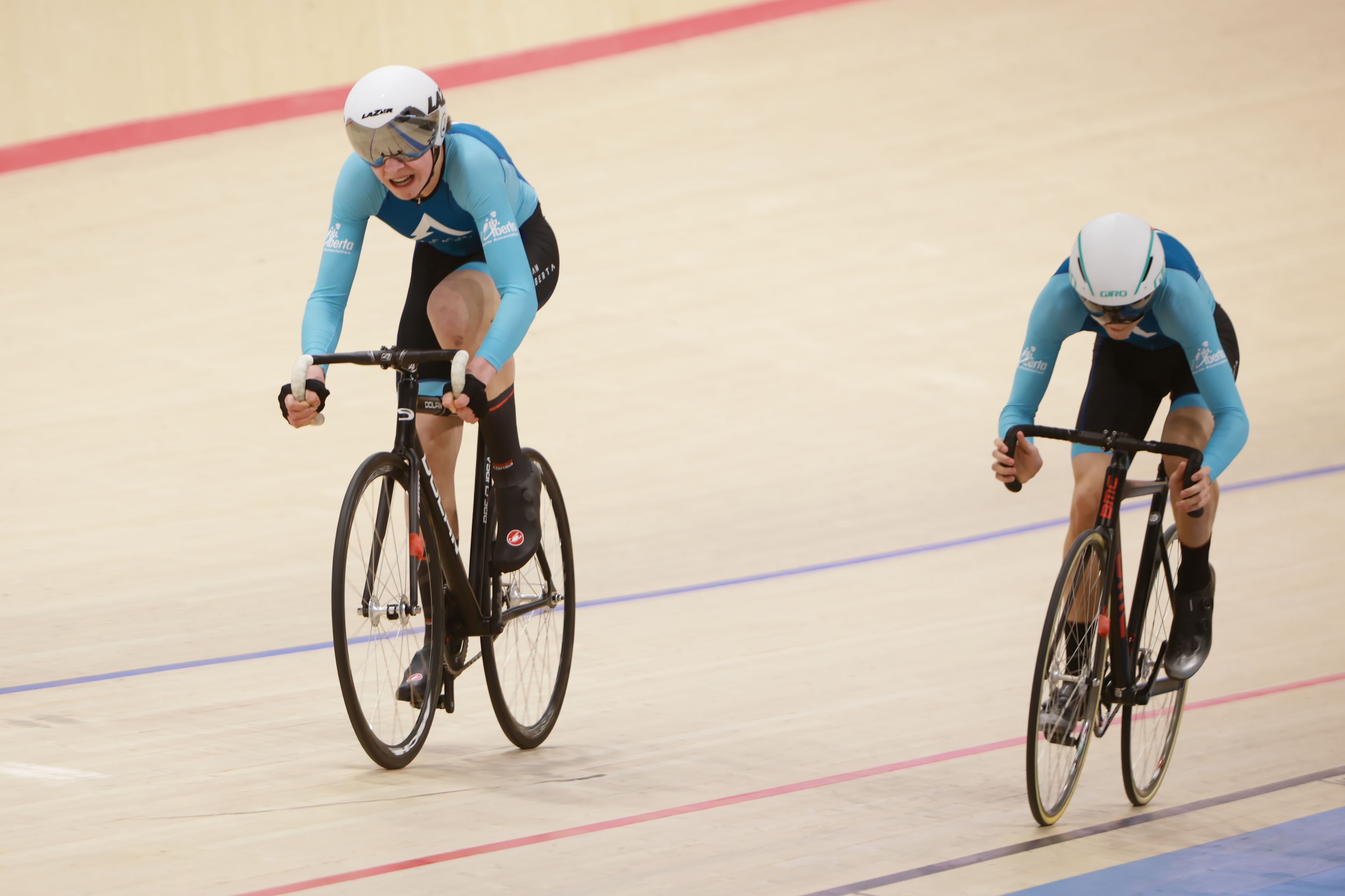 Two Team Alberta riders in a pursuit line