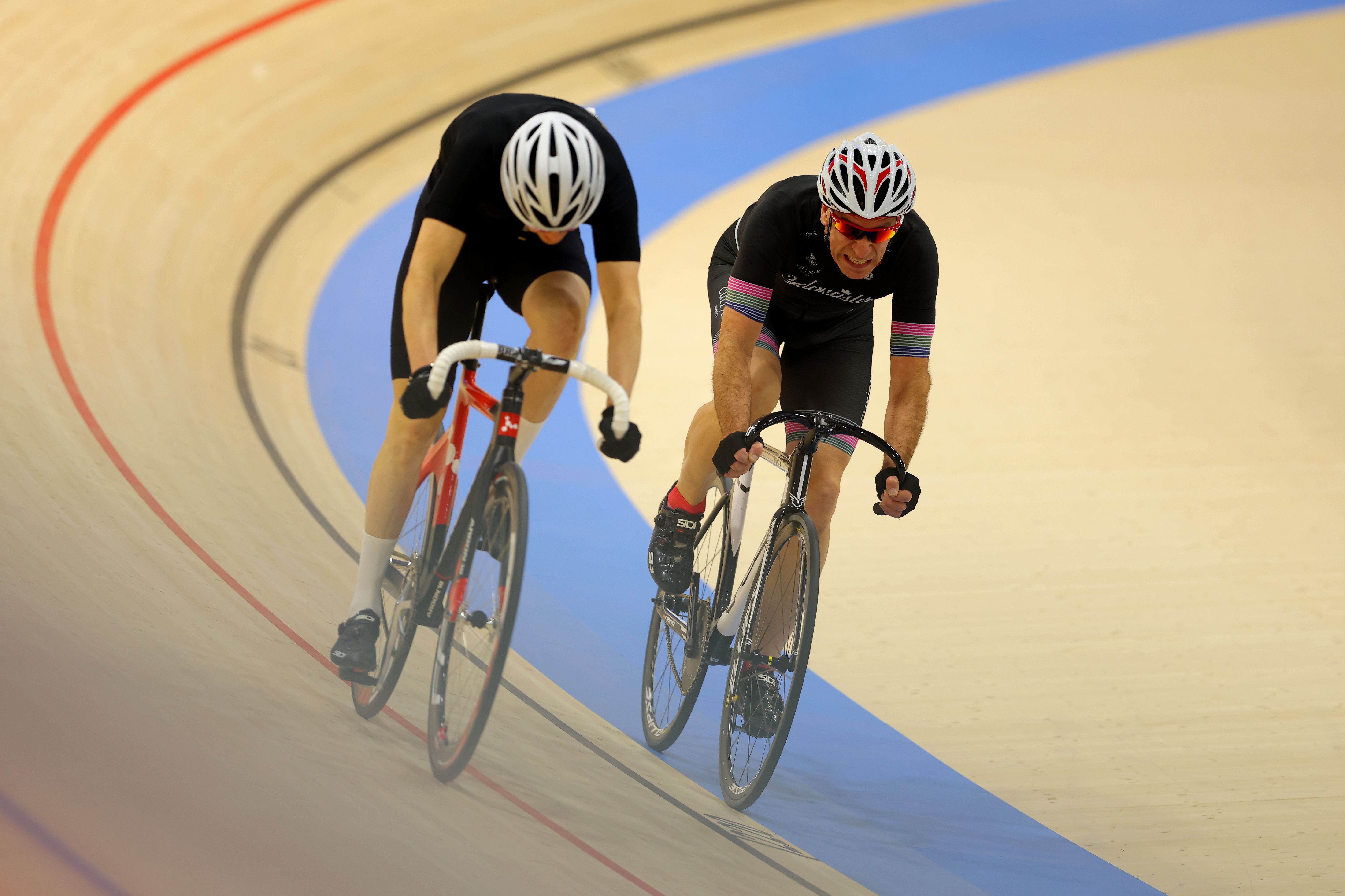 Two adult riders on the banking during a session