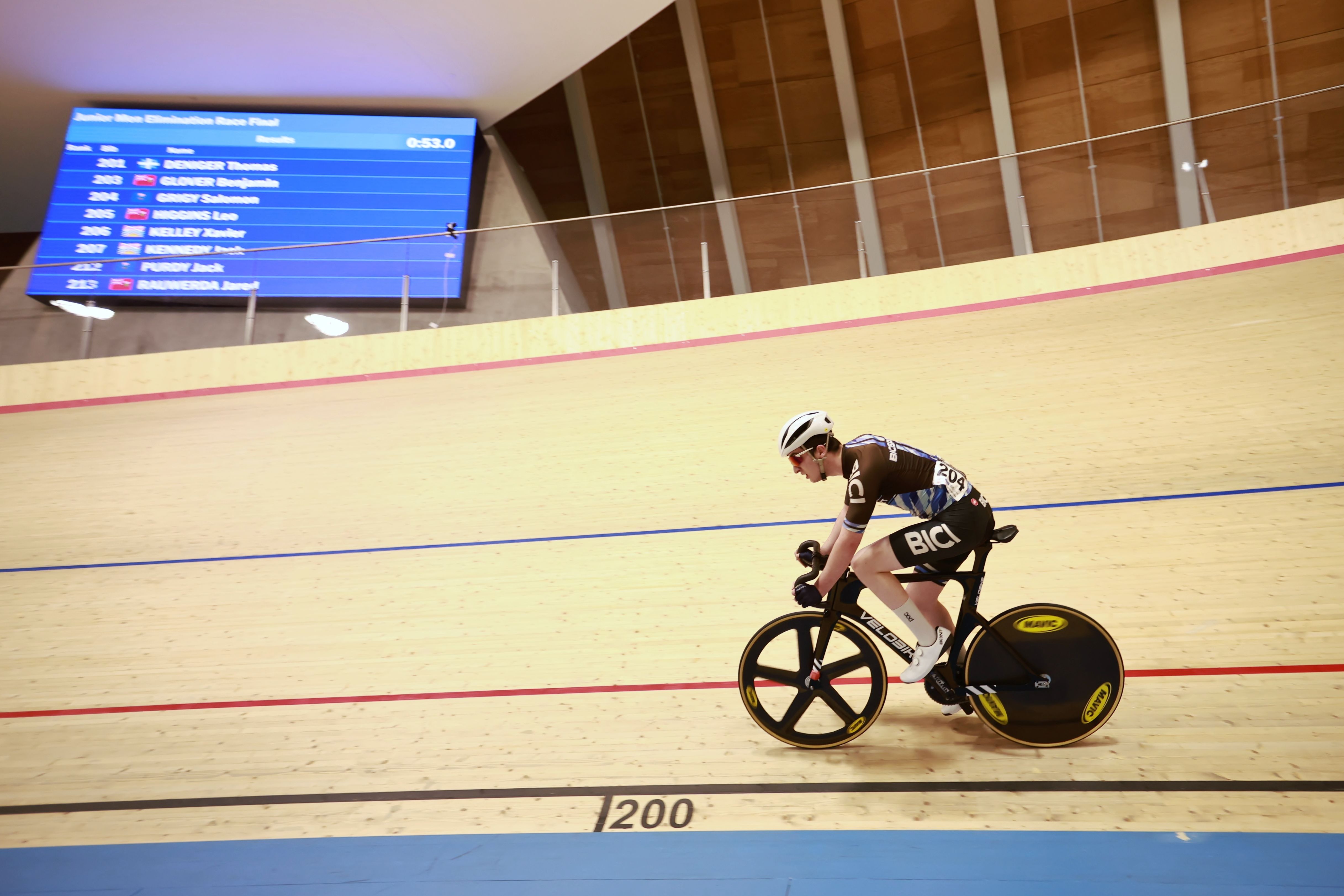 A rider passes the 200-metre mark