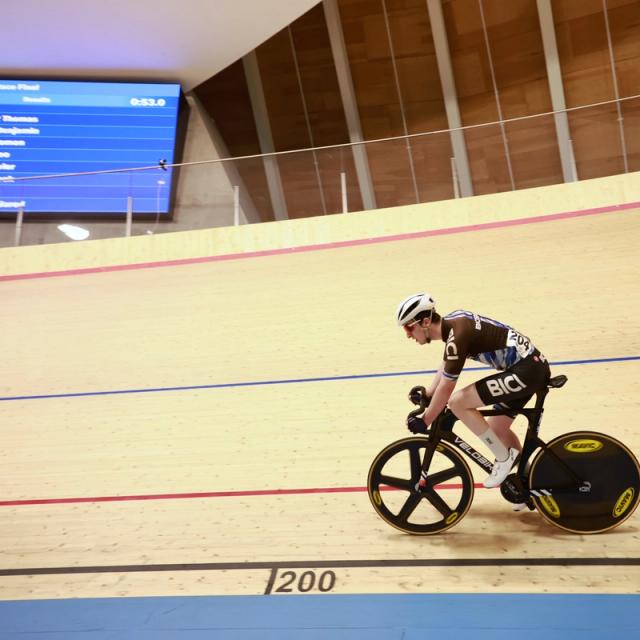 A rider passes the 200-metre mark