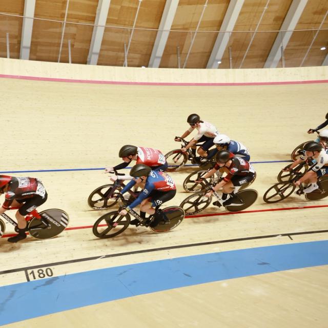 A bunch races along the banking
