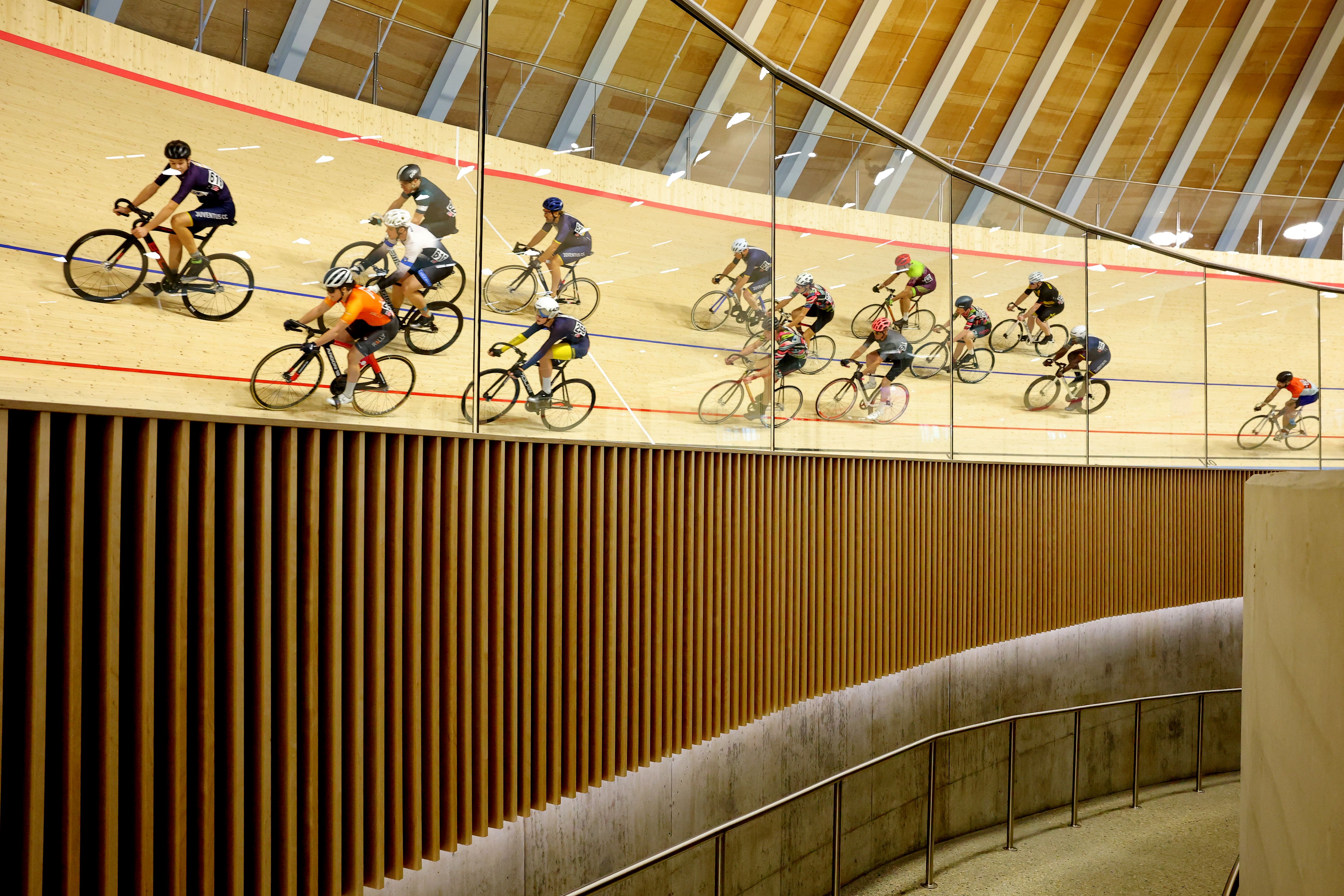 Riders on the banking against the timber wall