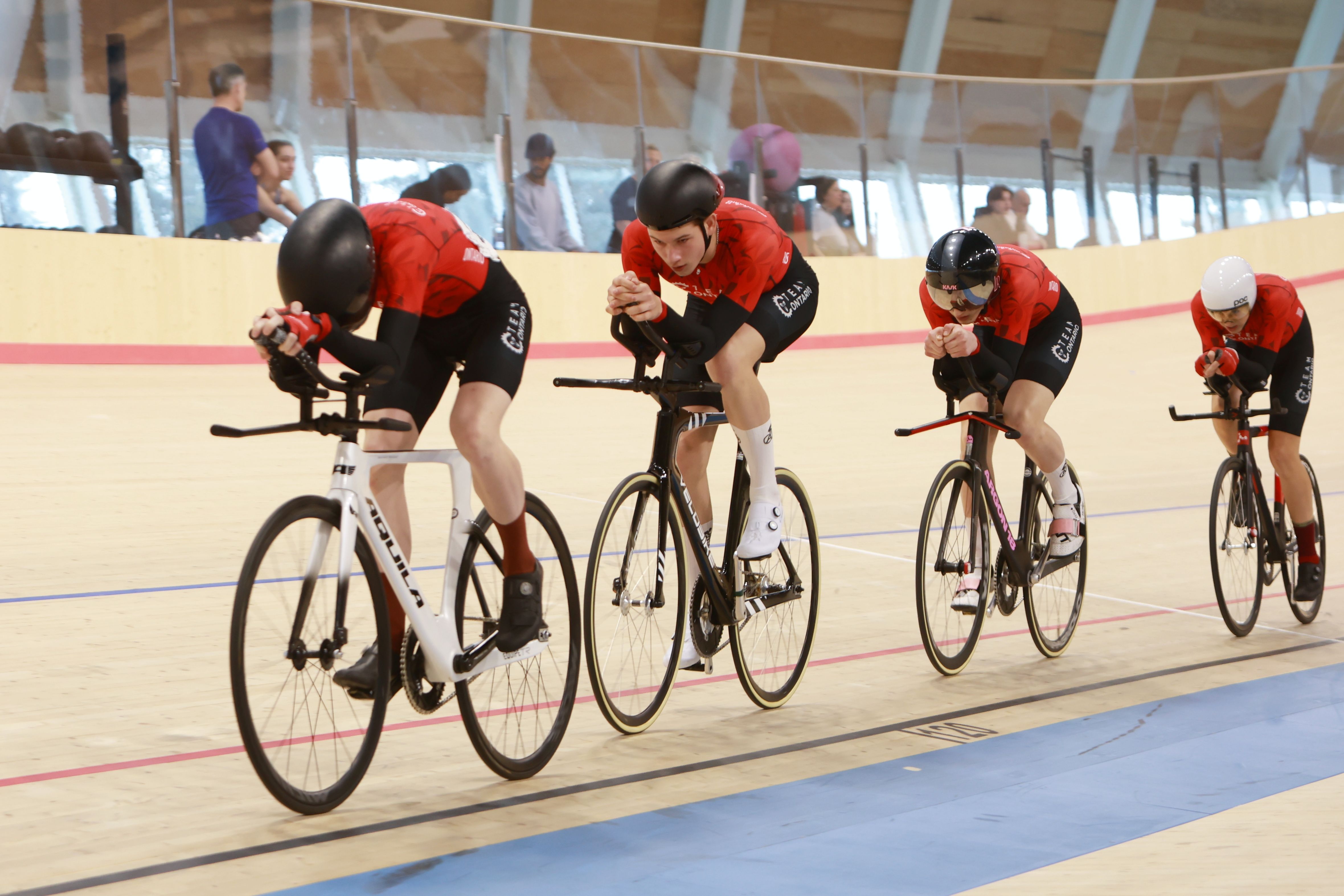 A team pursuit squad rides in formation
