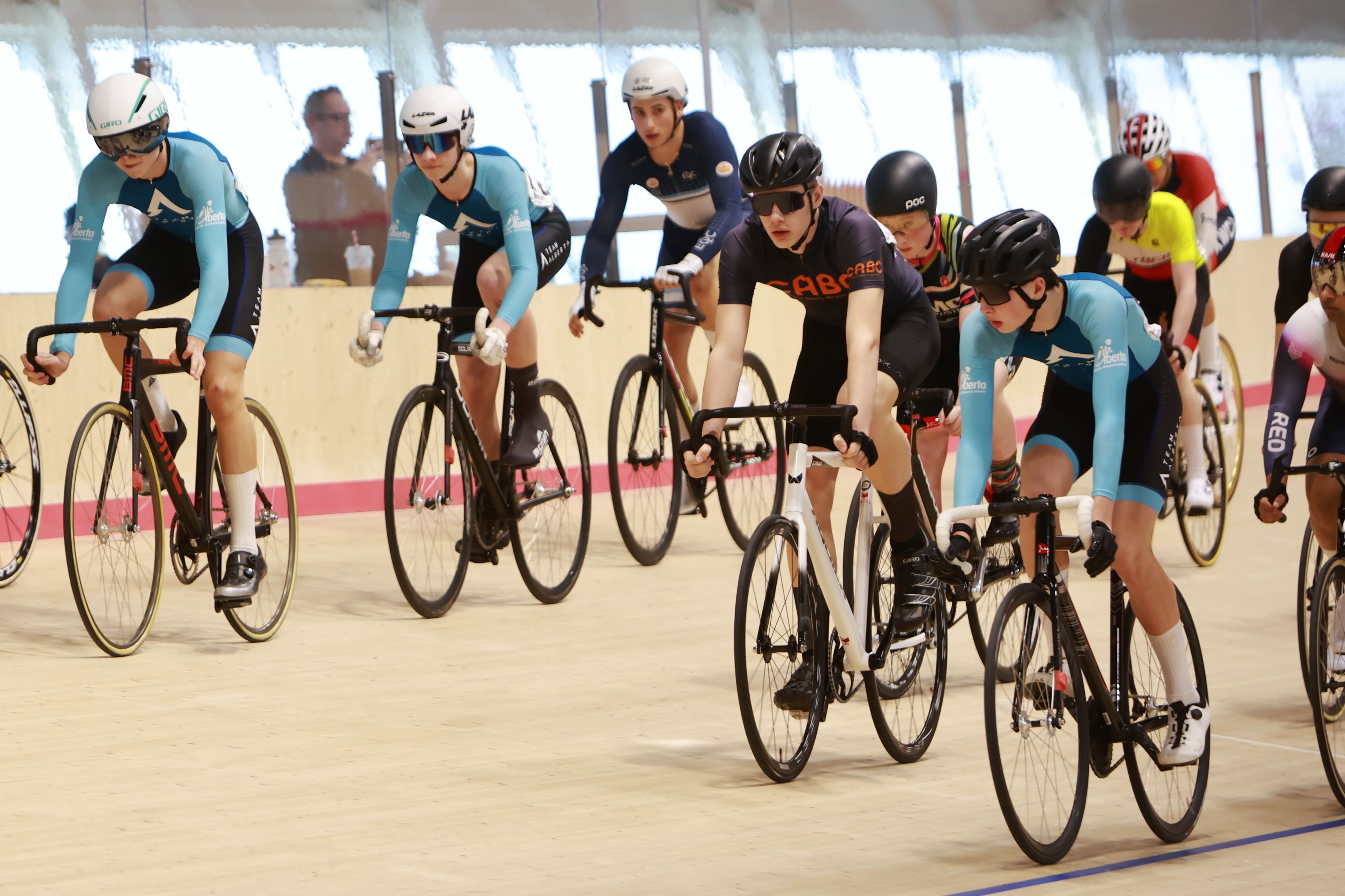 Junior riders bunched on the banking