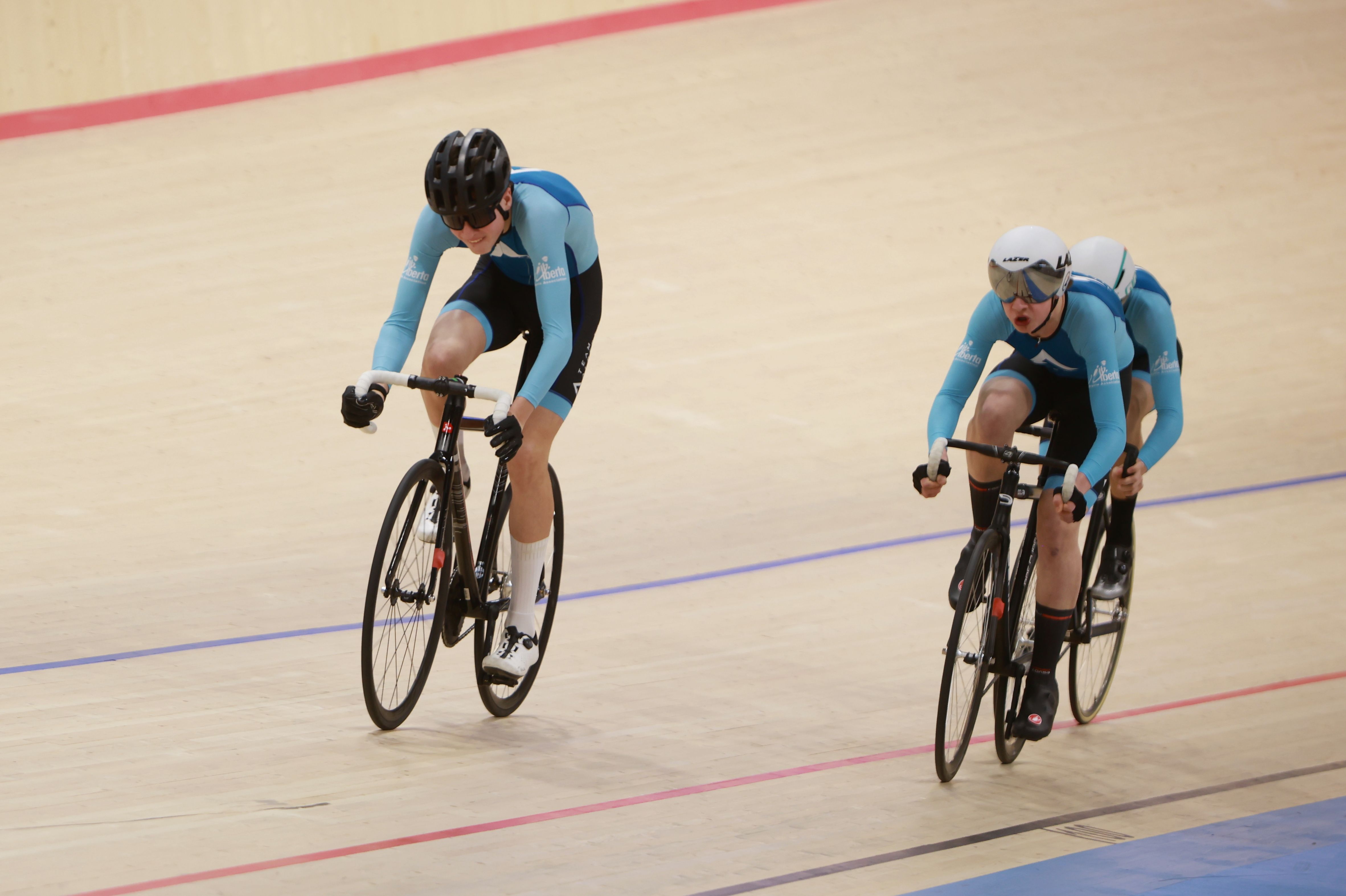 Two Team Alberta youth riders on the track