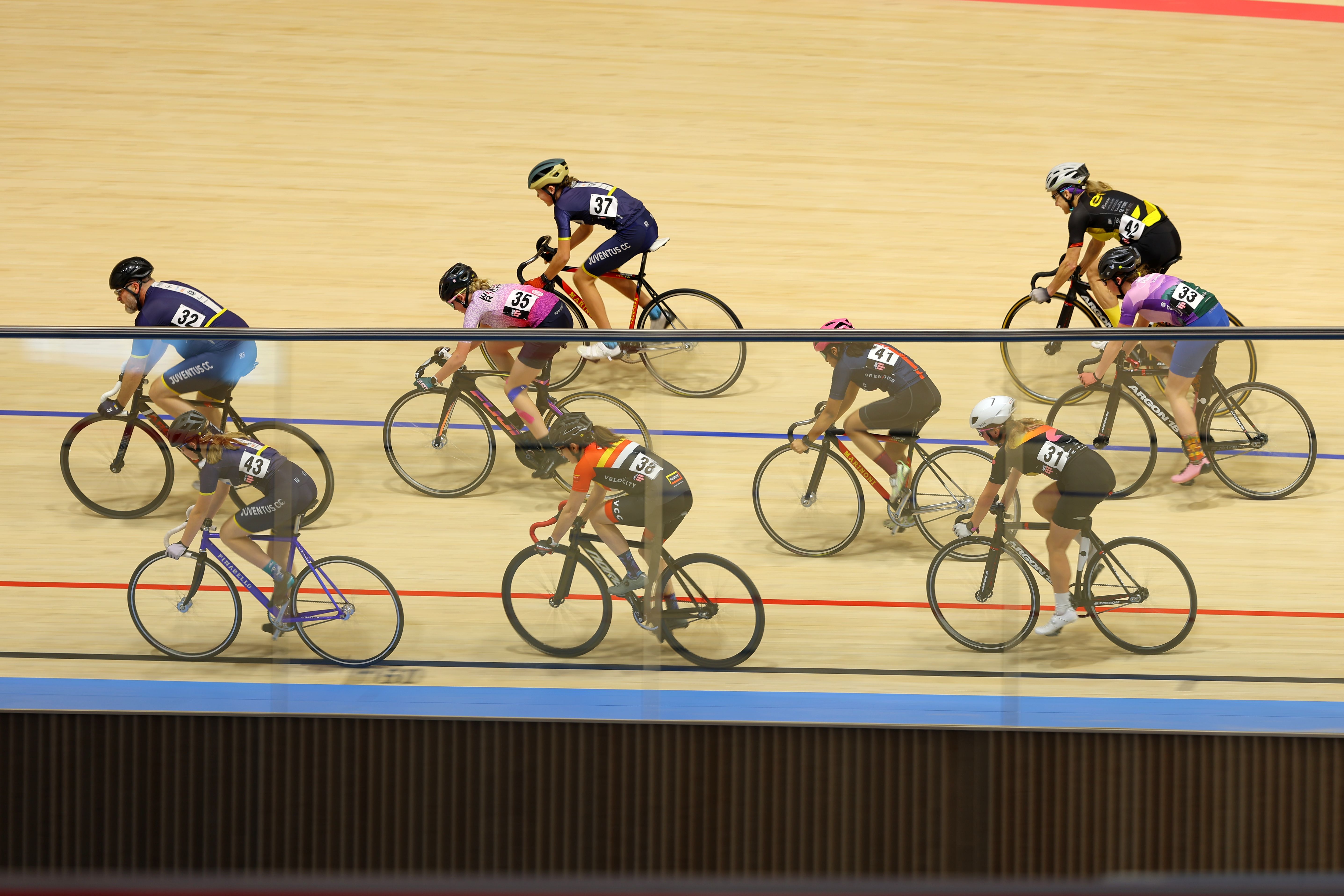 A group of adult riders on the banking