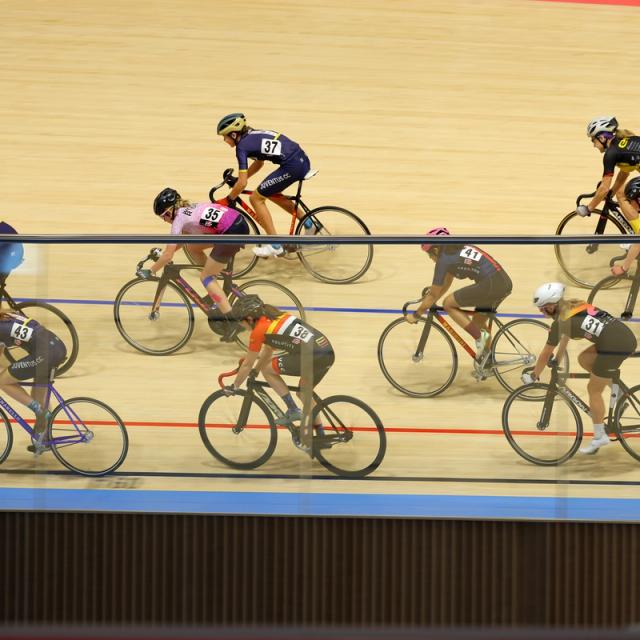 A group of adult riders on the banking