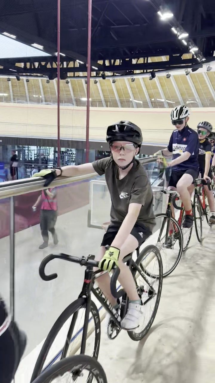 Young riders waiting at the rail during a youth session