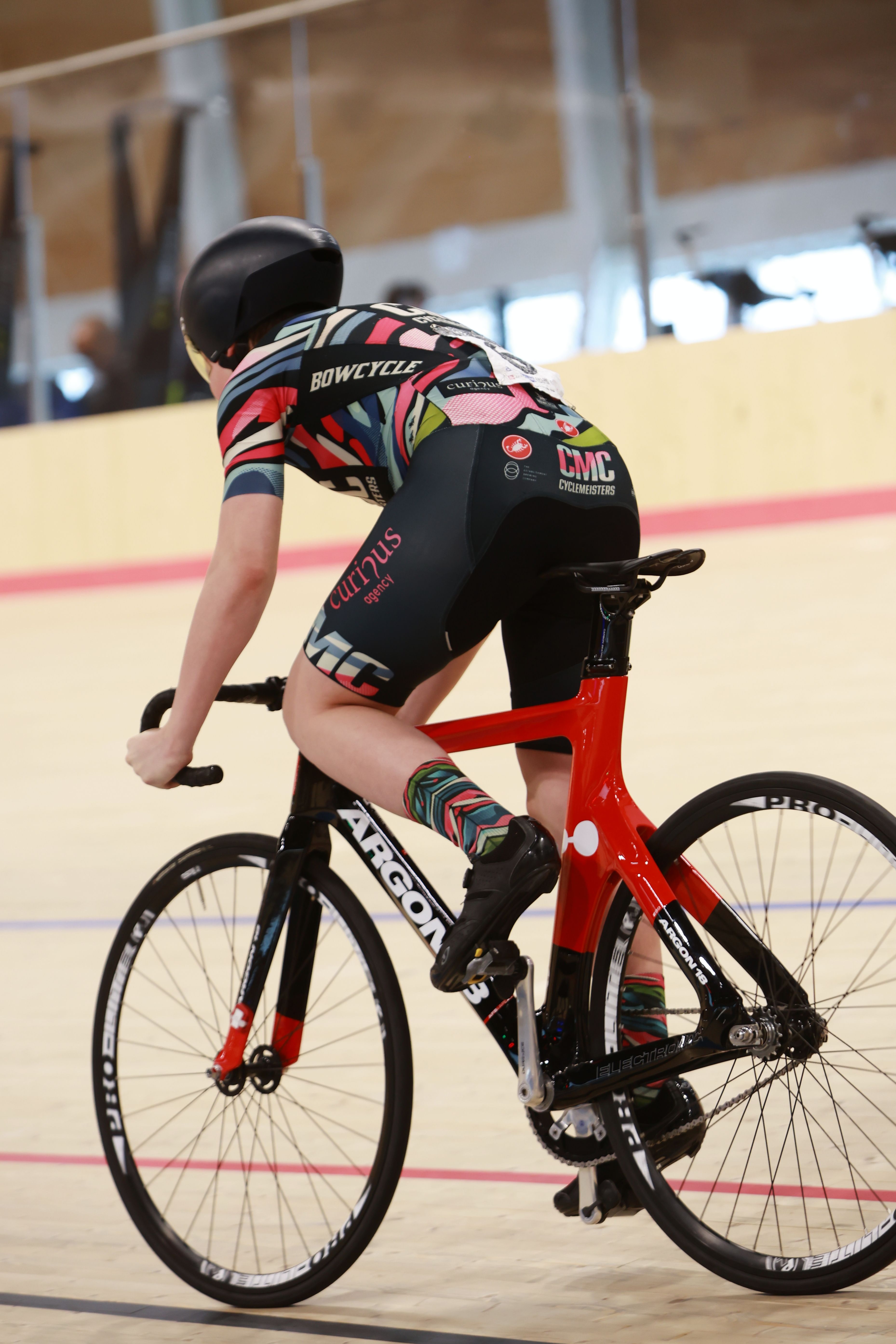 A pursuit rider in an aerodynamic position