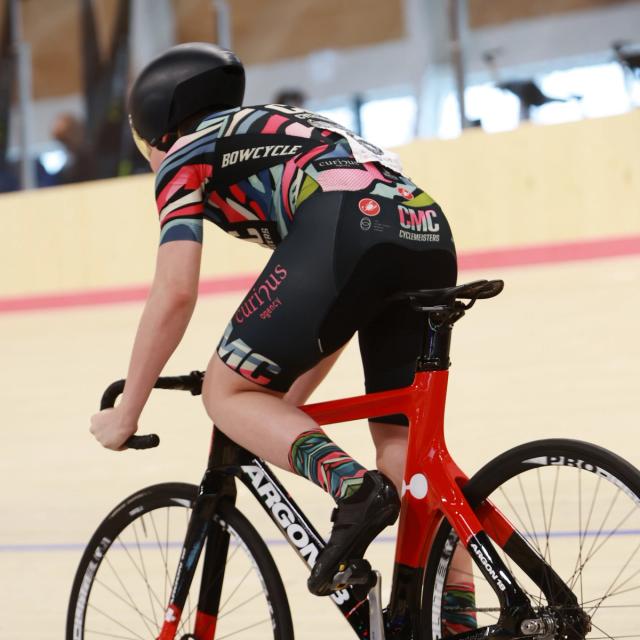A pursuit rider in an aerodynamic position