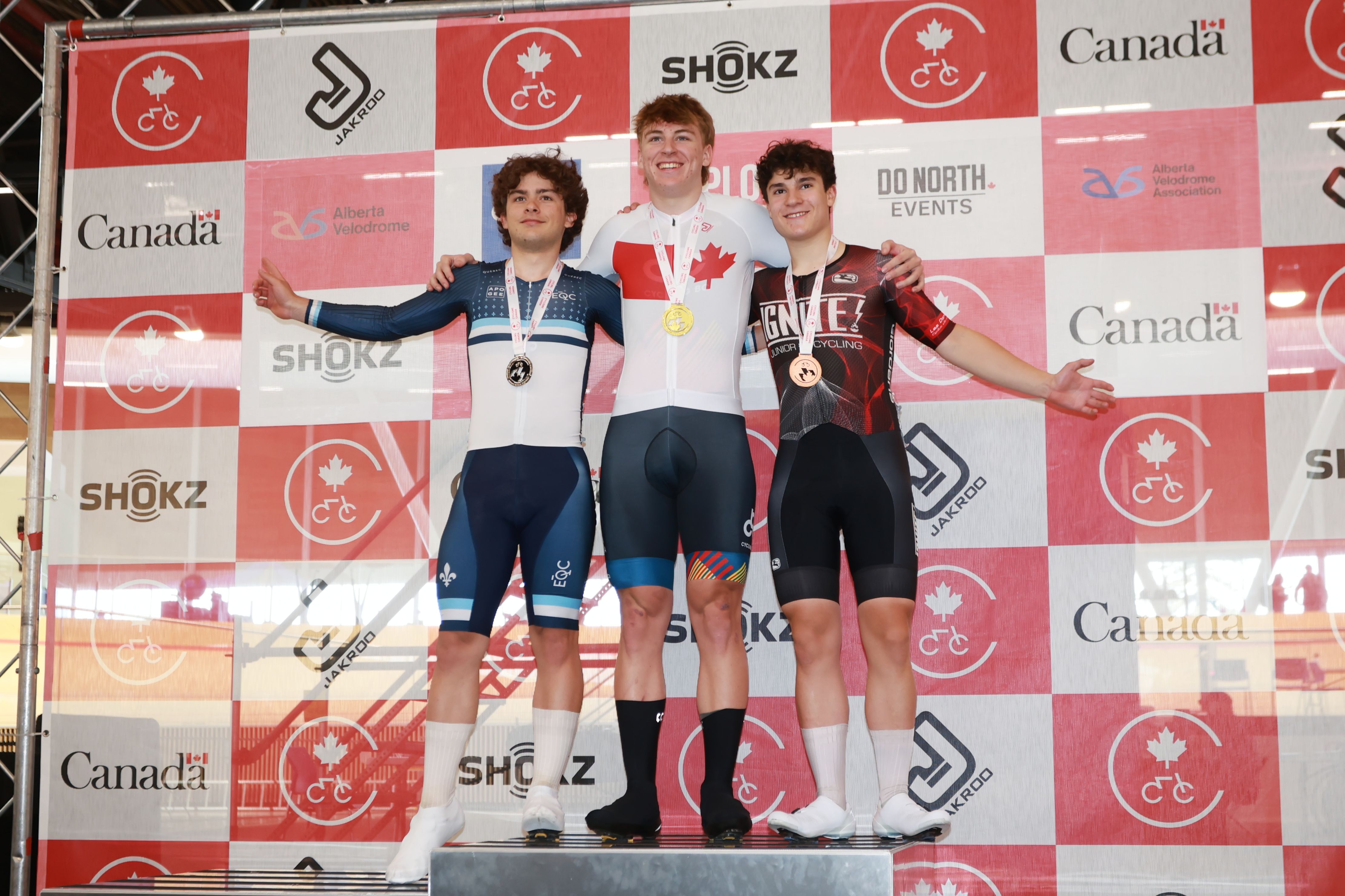 Medallists celebrate on the podium